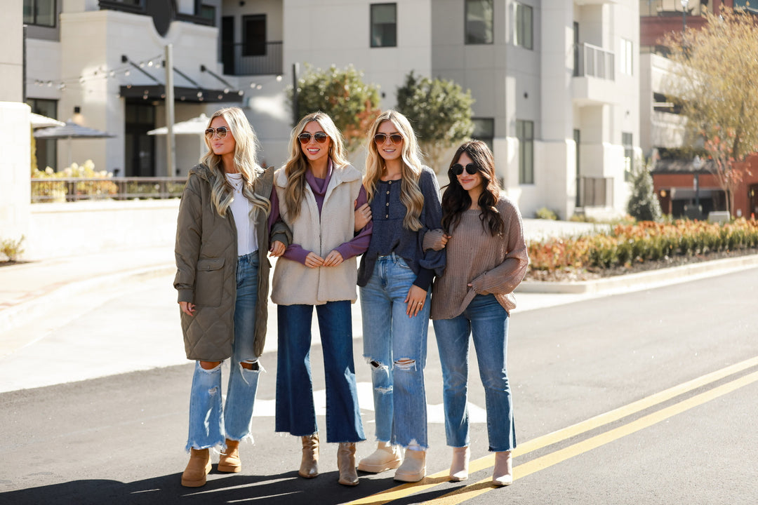 four models all wearing different styles of jeans