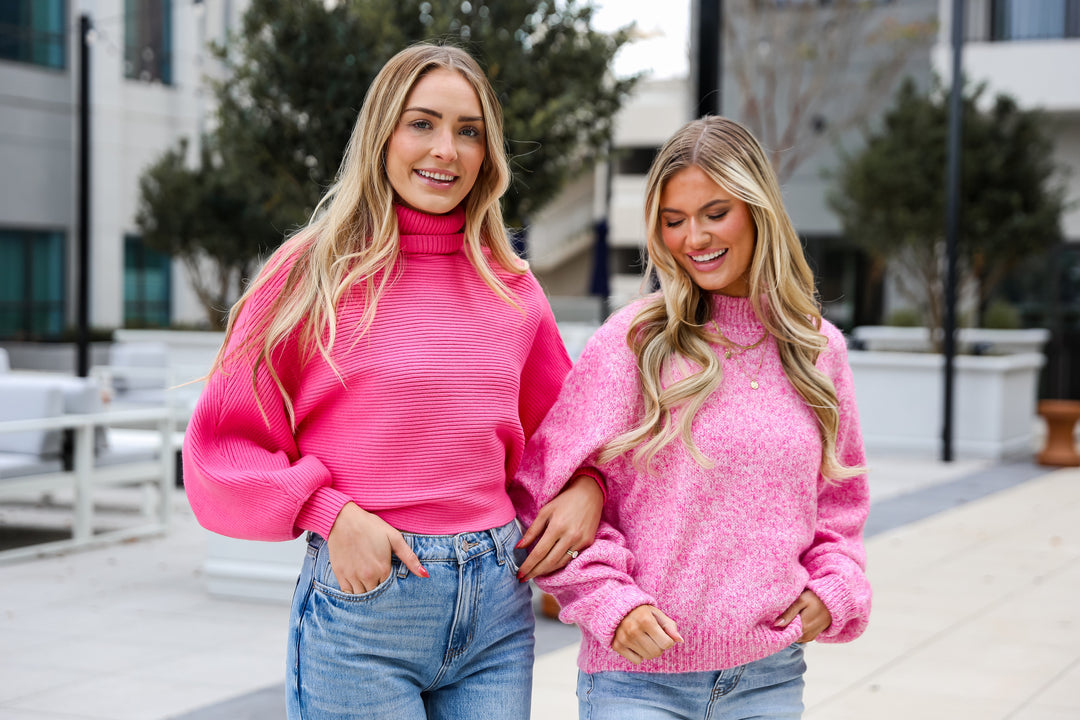 models wearing hot pink sweaters