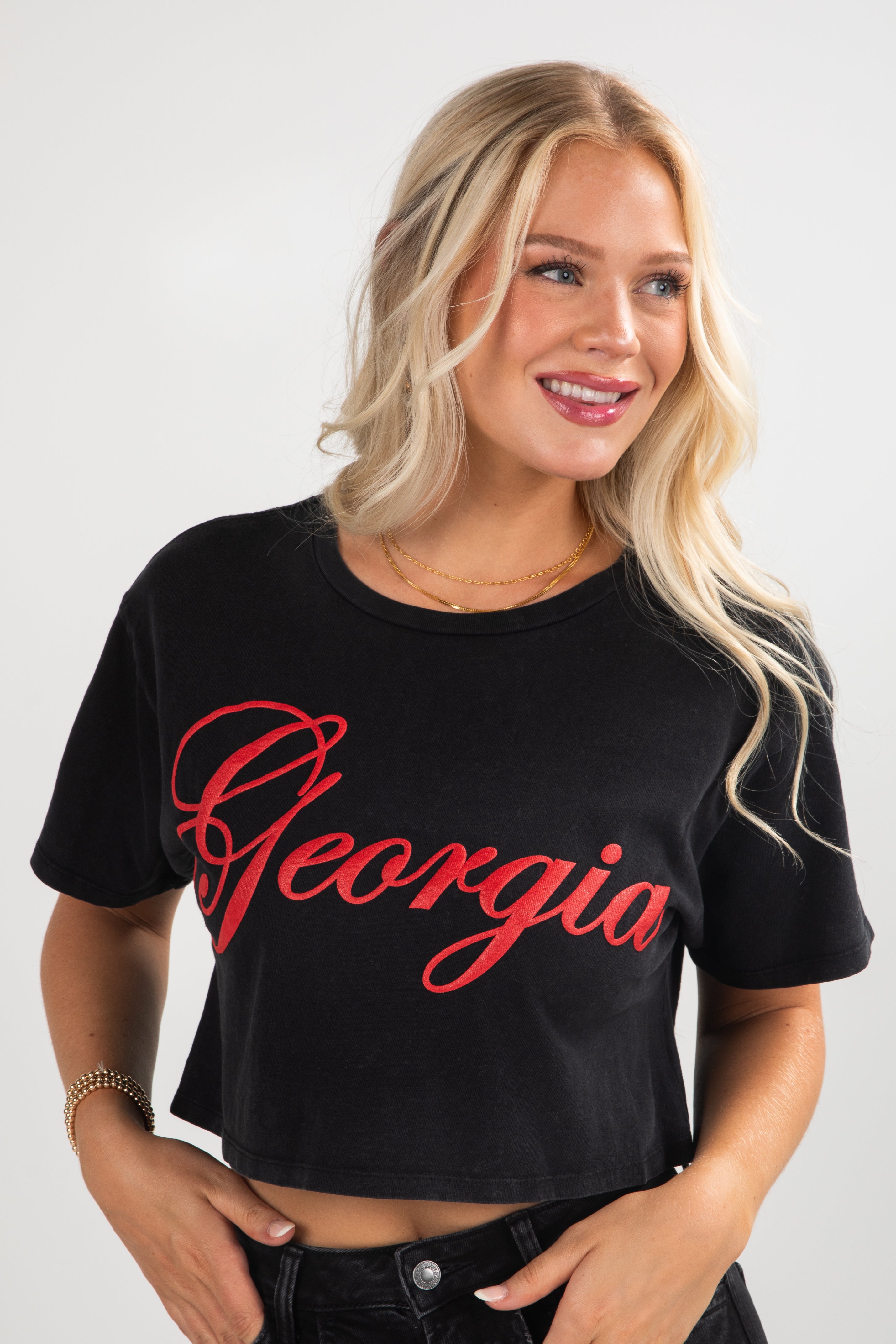 Woman wearing a black t-shirt with &