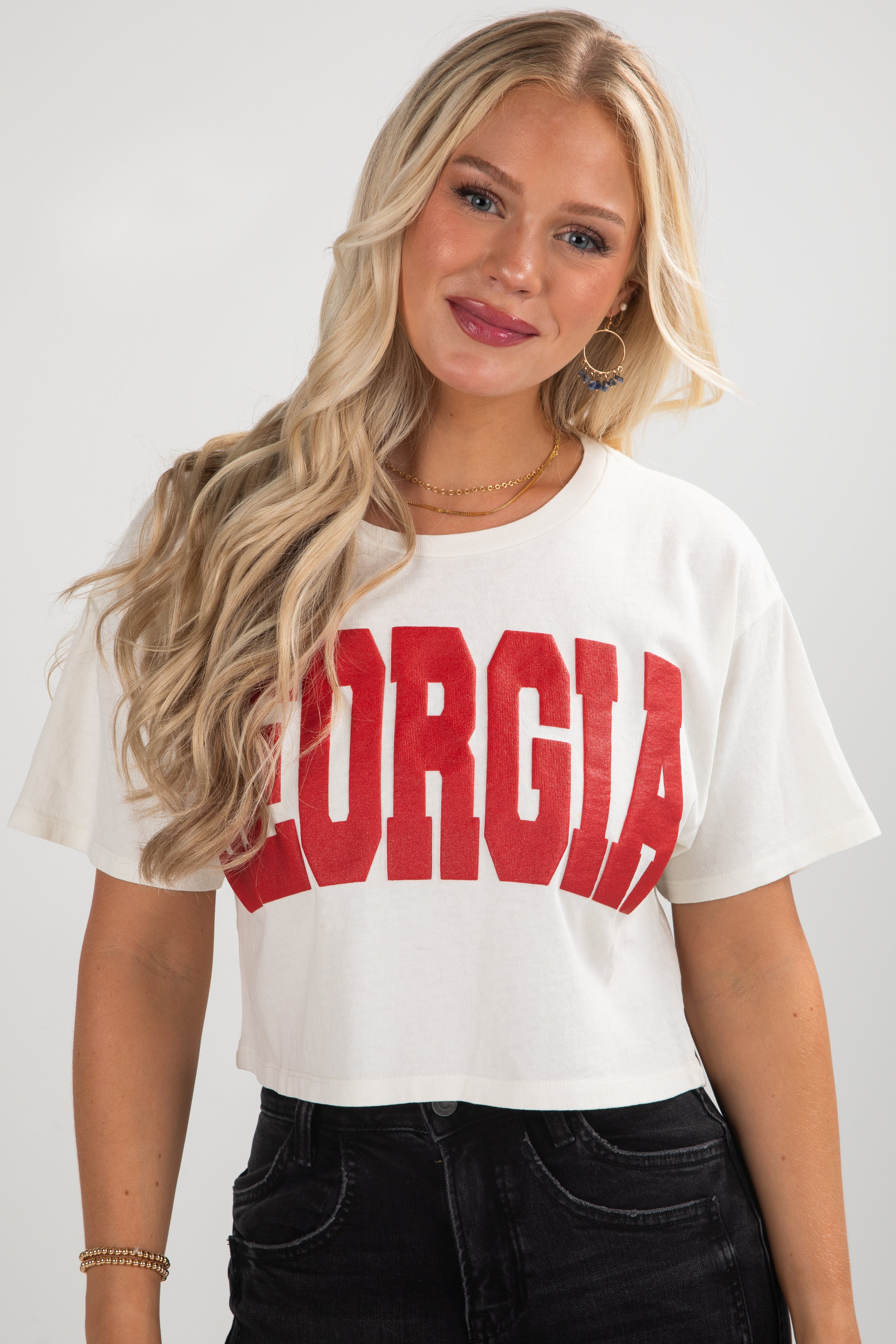 Woman wearing a white t-shirt with &