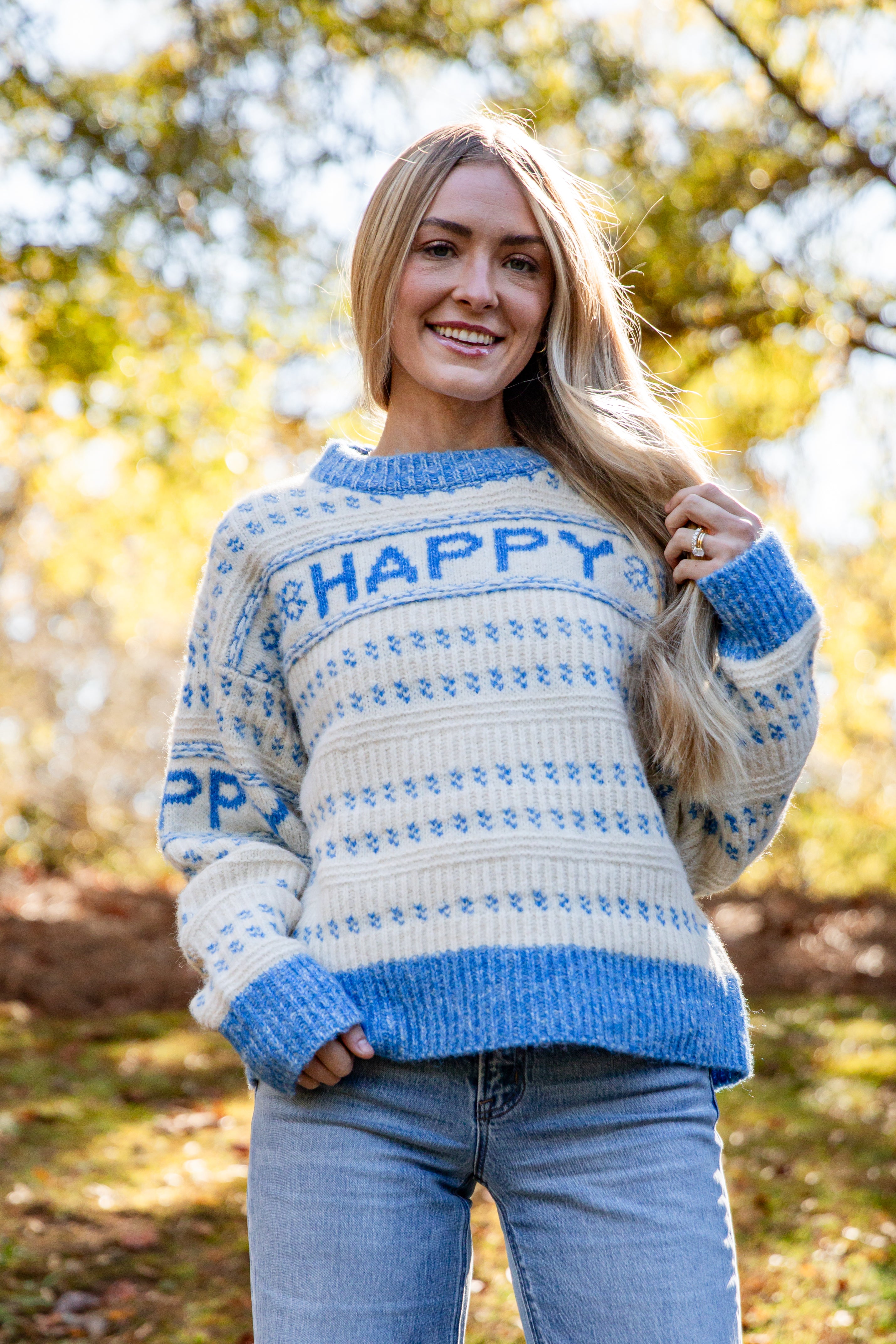 Woman wearing a sweater with &