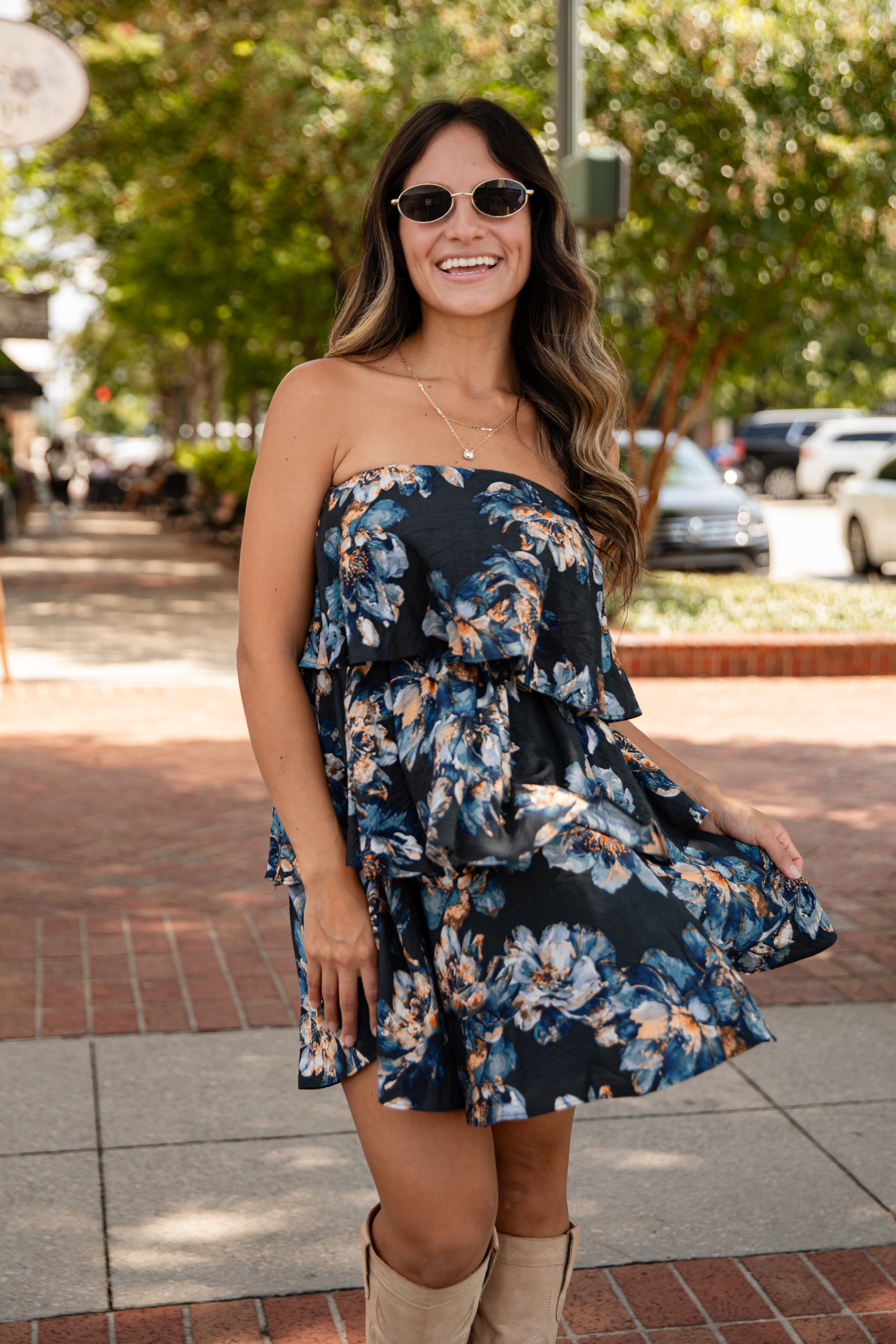 Woman wearing a floral dress on a city street