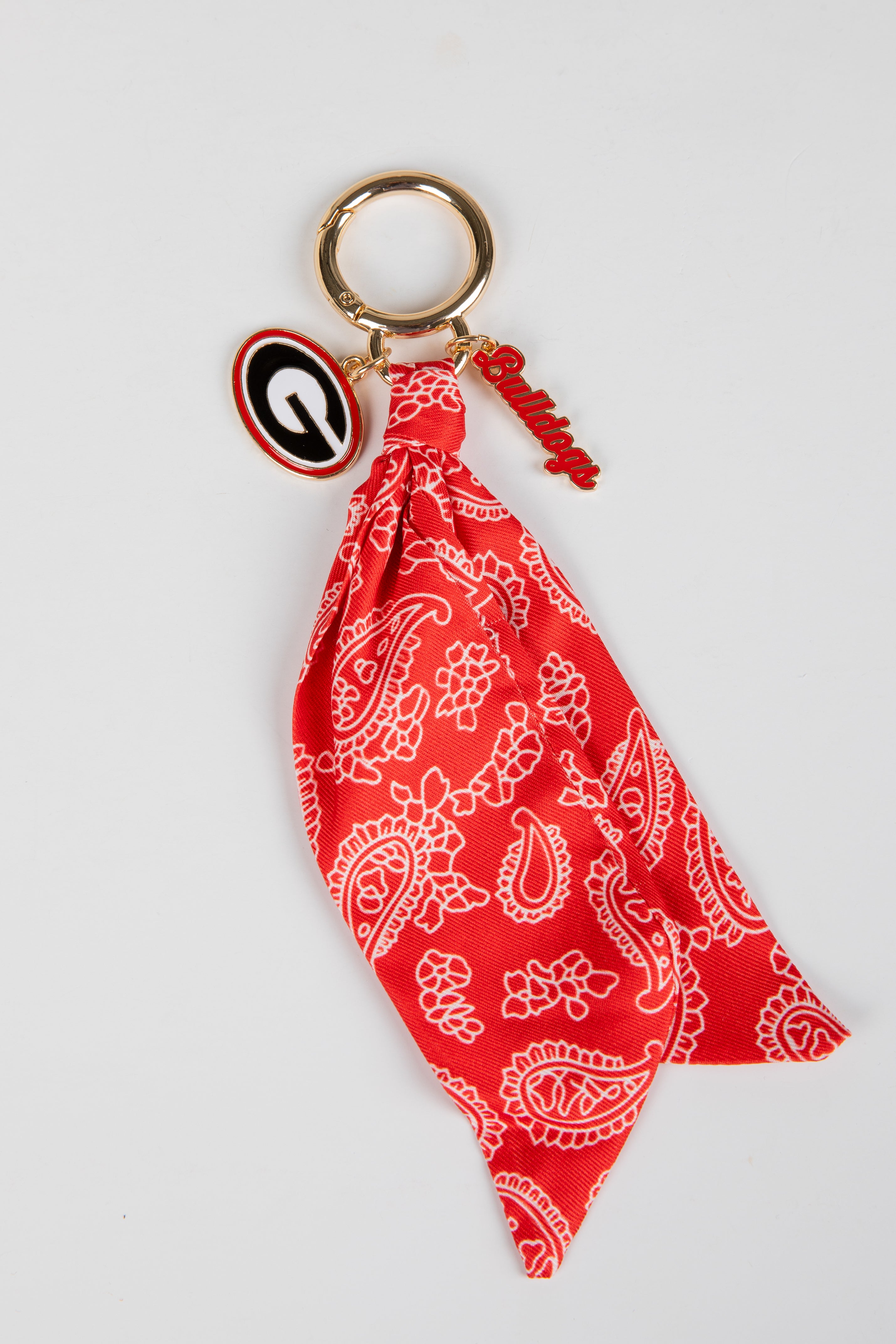 Red bandana keychain with a keyring on a white background