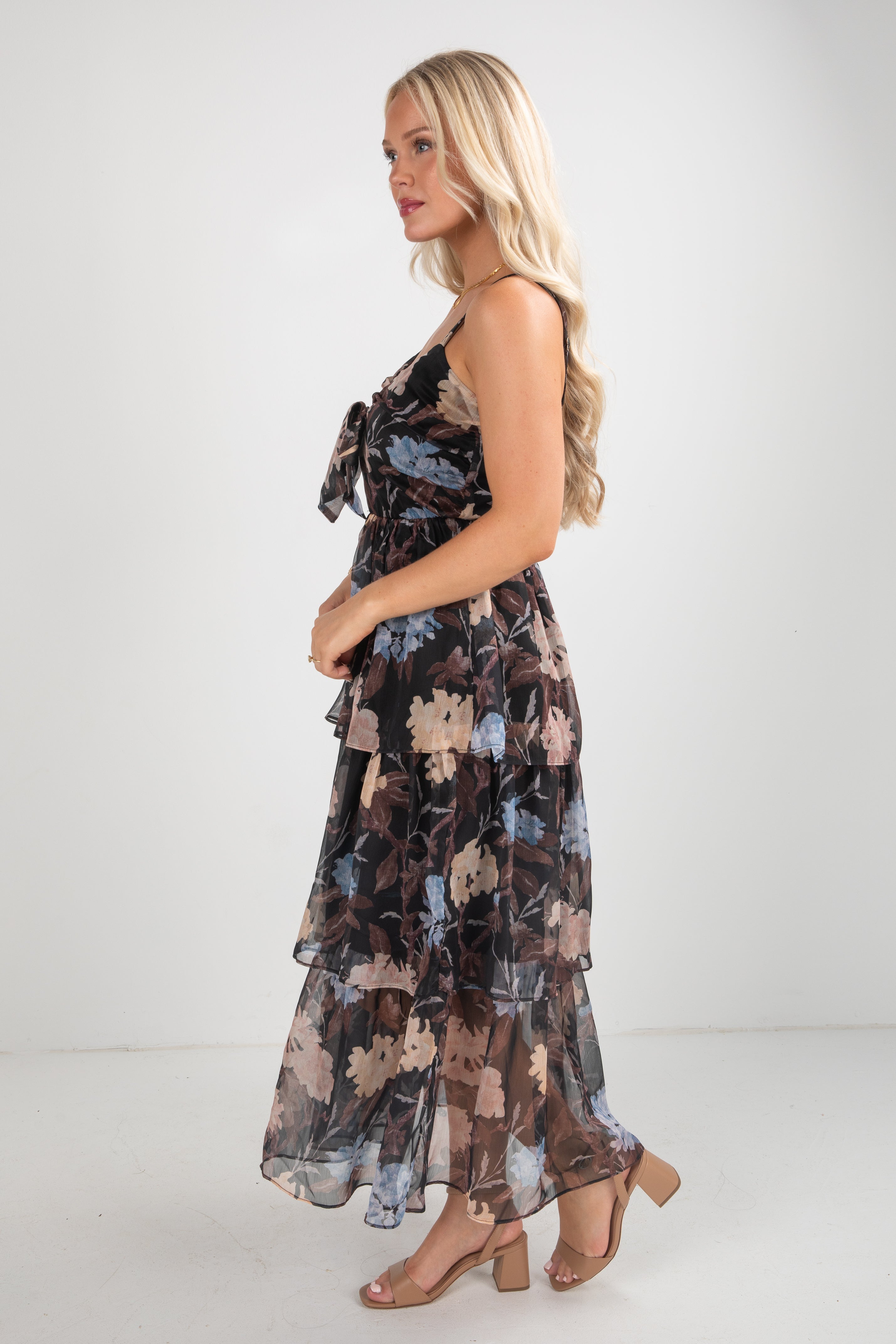 Woman wearing a floral dress on a white background