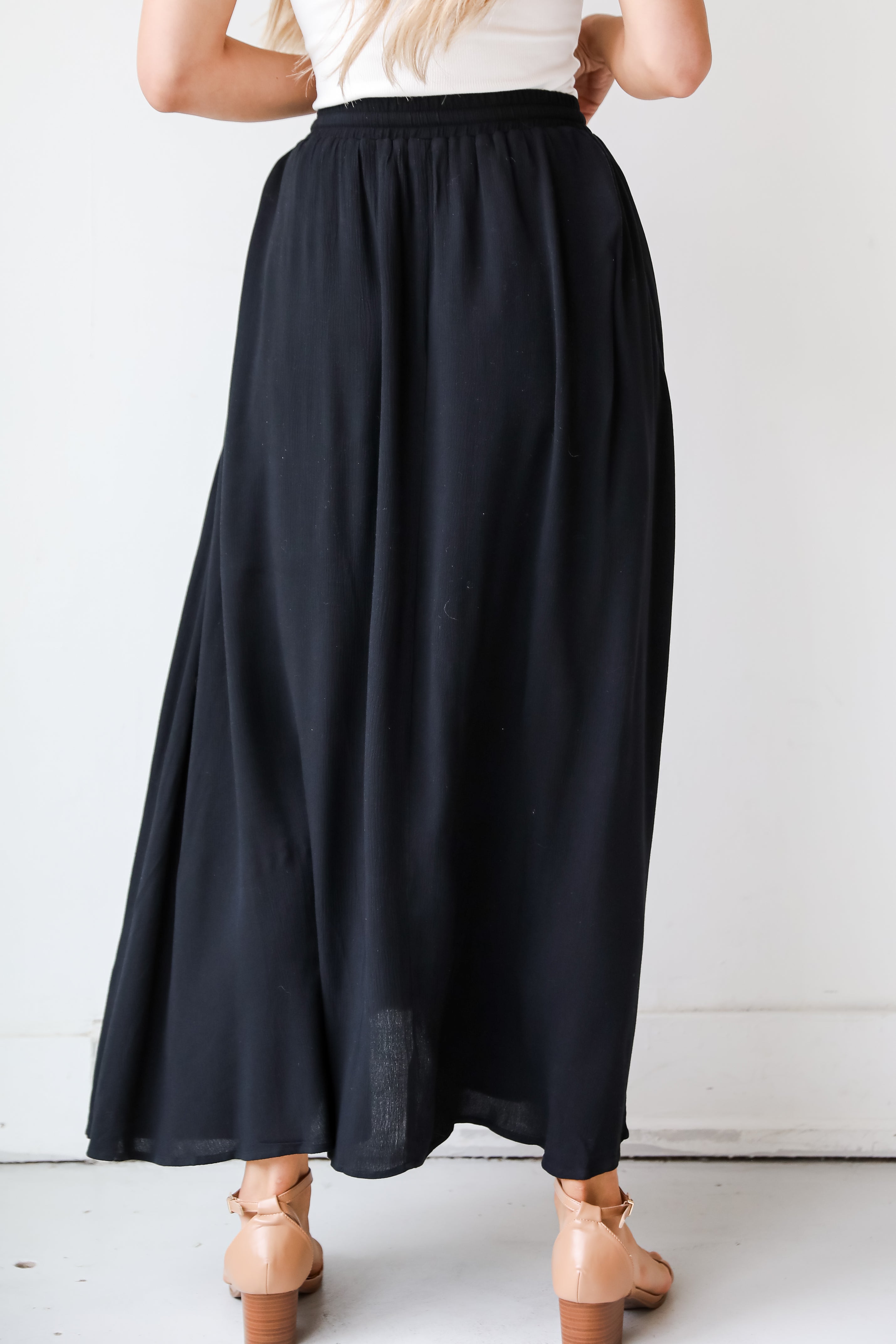 On My Mind Black Maxi Skirt has a flowy fit, elastic waistband, high-waisted skirt. Cute black skirt for summer. Pair with cute sandals, spring break outfit. online boutique