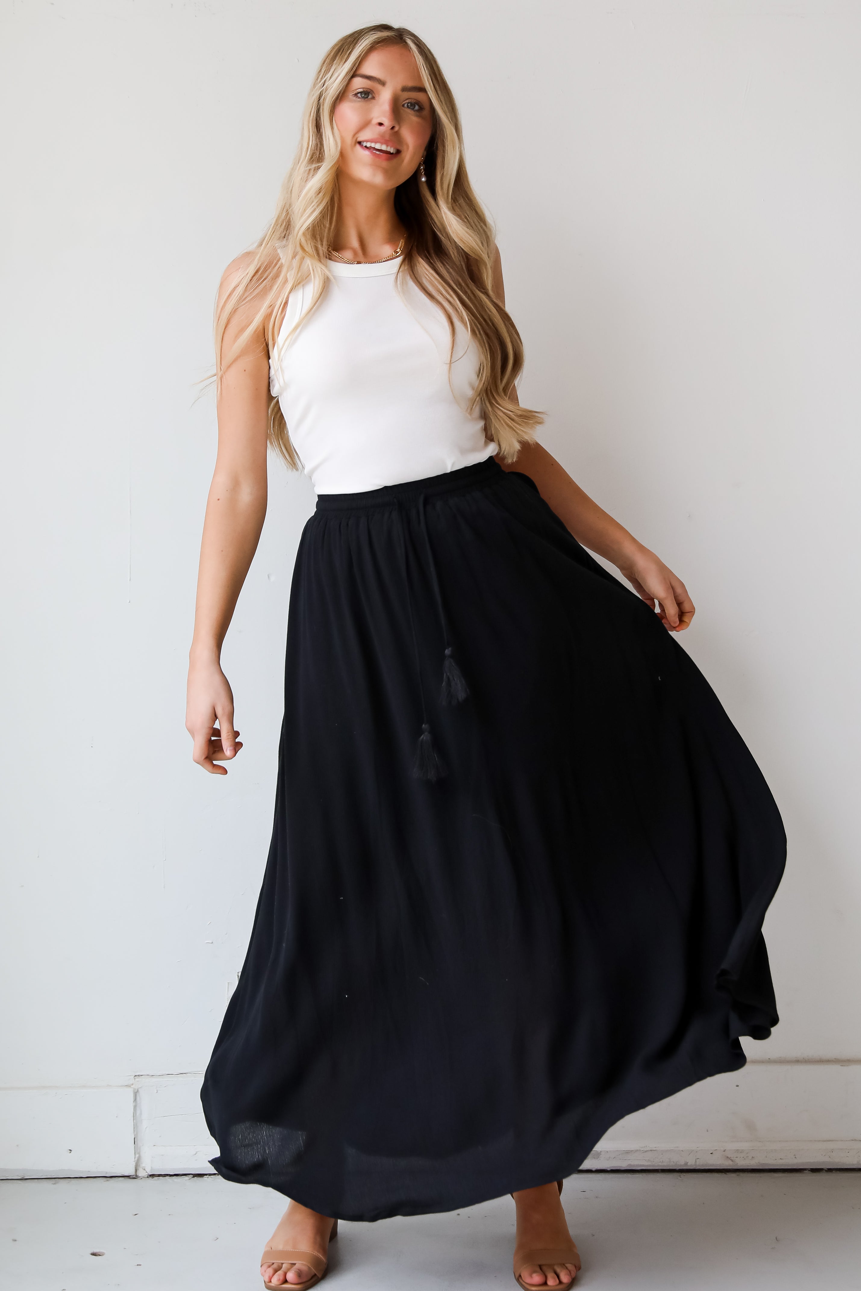 On My Mind Black Maxi Skirt has a flowy fit, elastic waistband, high-waisted skirt. Cute black skirt for summer. Pair with cute sandals, spring break outfit. online boutique