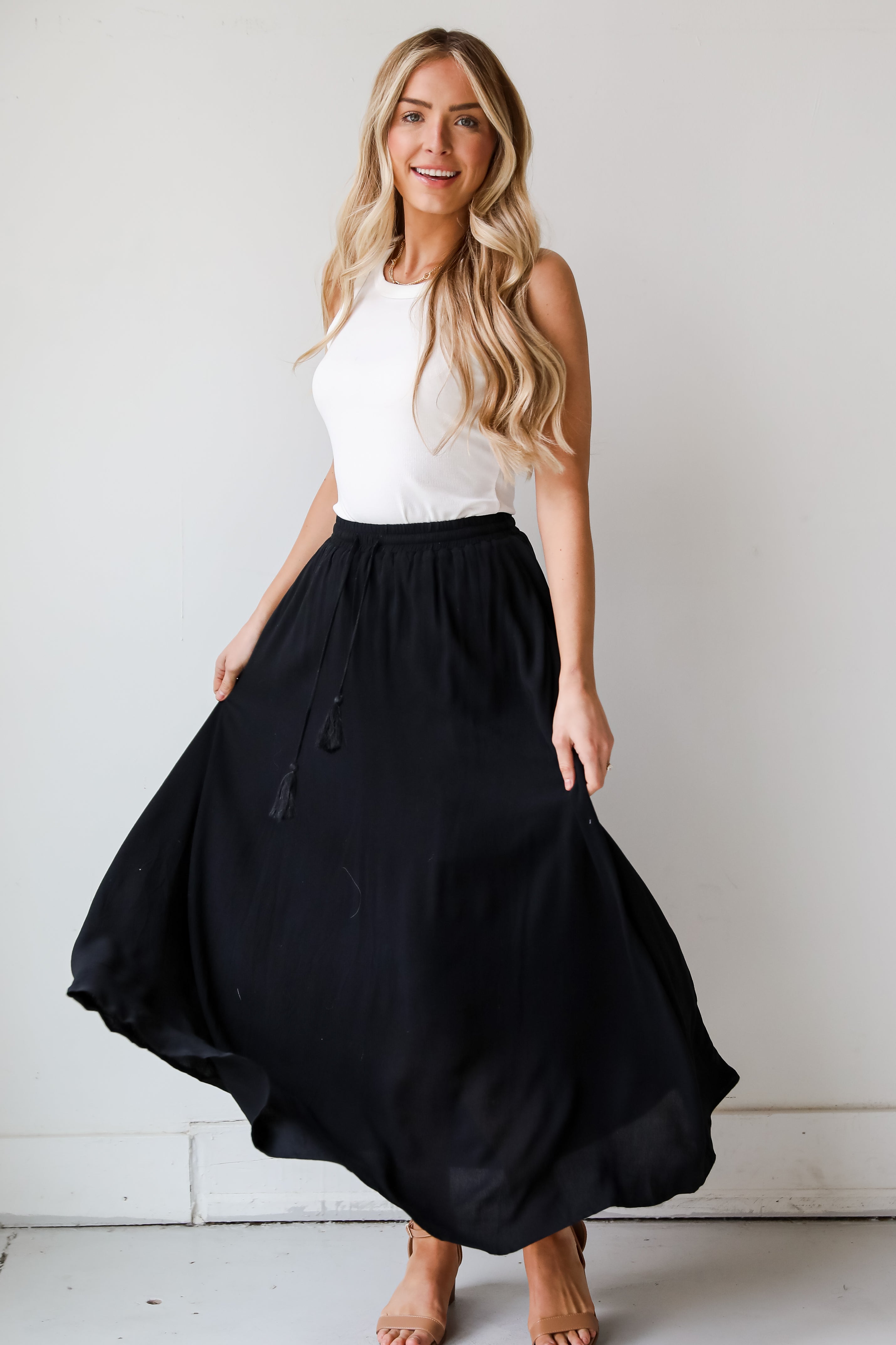 On My Mind Black Maxi Skirt has a flowy fit, elastic waistband, high-waisted skirt. Cute black skirt for summer. Pair with cute sandals, spring break outfit. online boutique