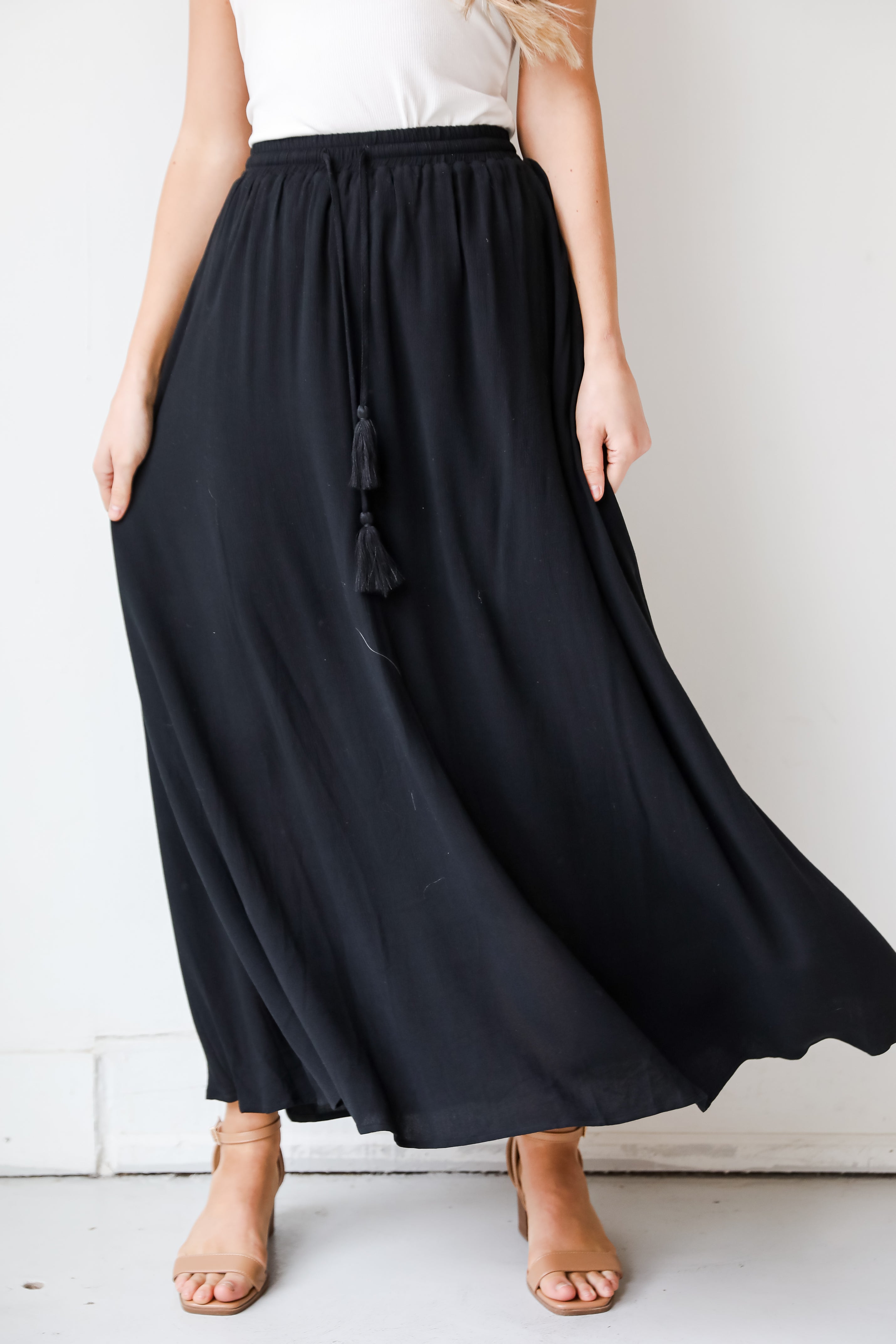 On My Mind Black Maxi Skirt has a flowy fit, elastic waistband, high-waisted skirt. Cute black skirt for summer. Pair with cute sandals, spring break outfit. online boutique