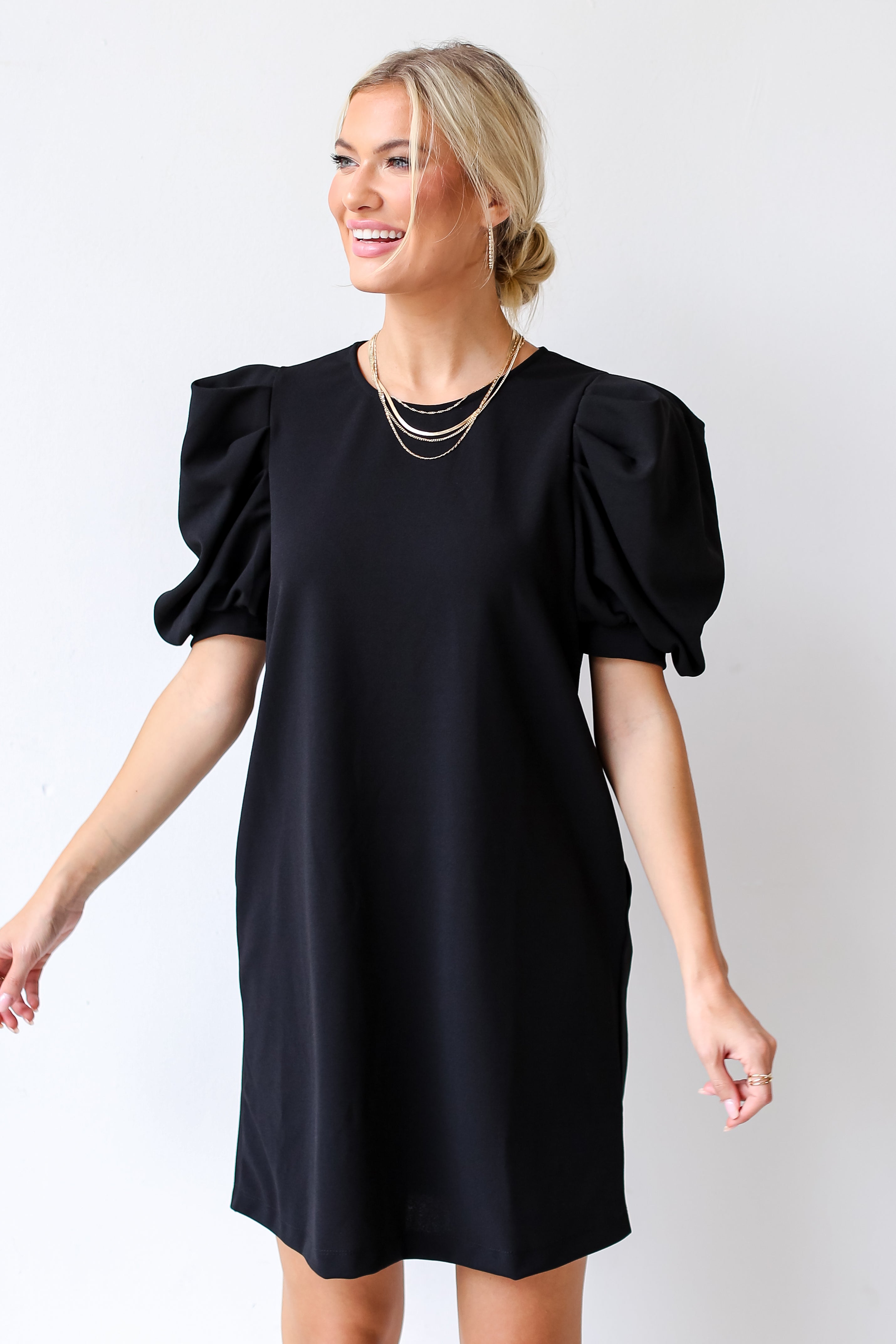 model wearing a black Puff Sleeve Mini Dress