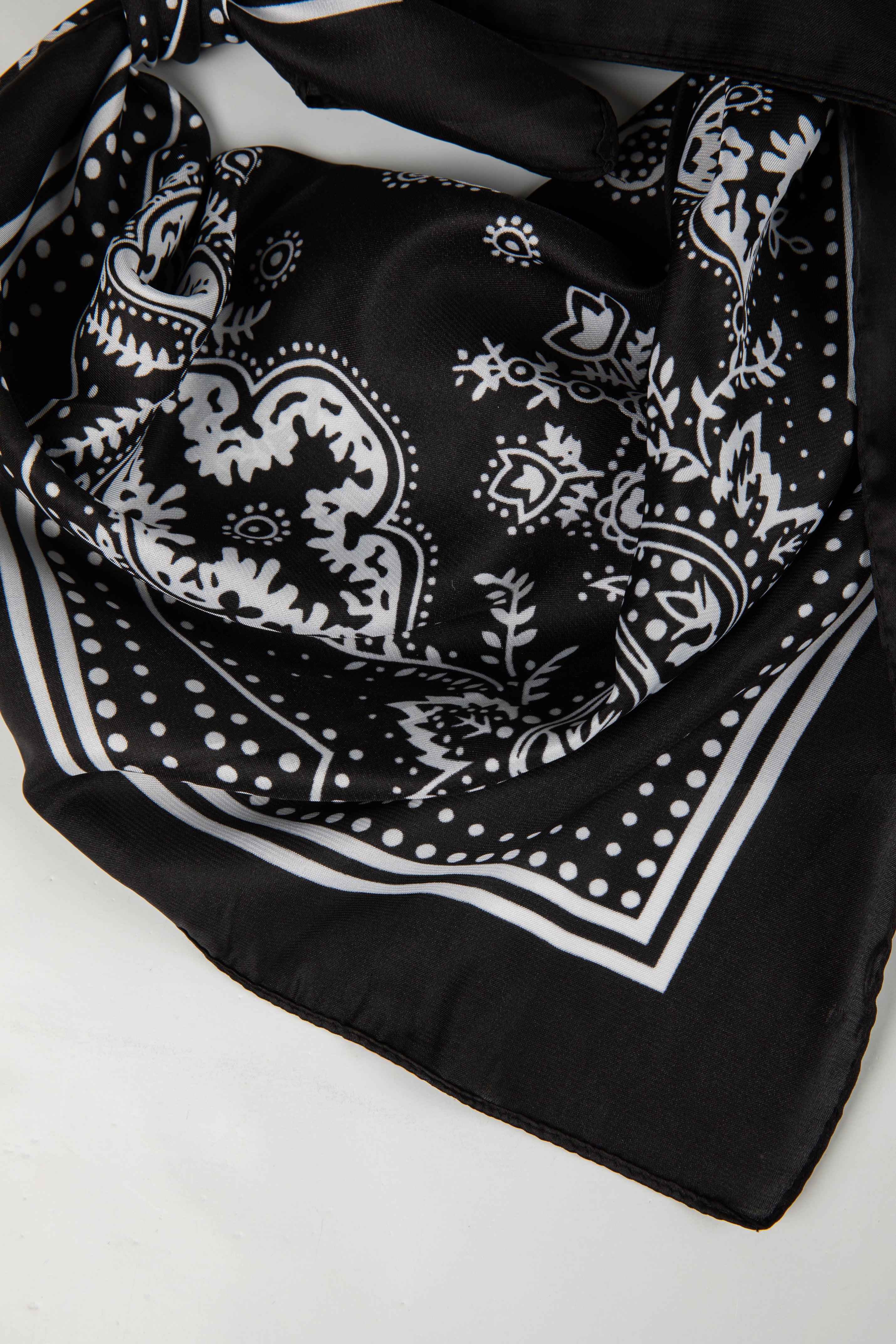 Black and white patterned scarf on a white background