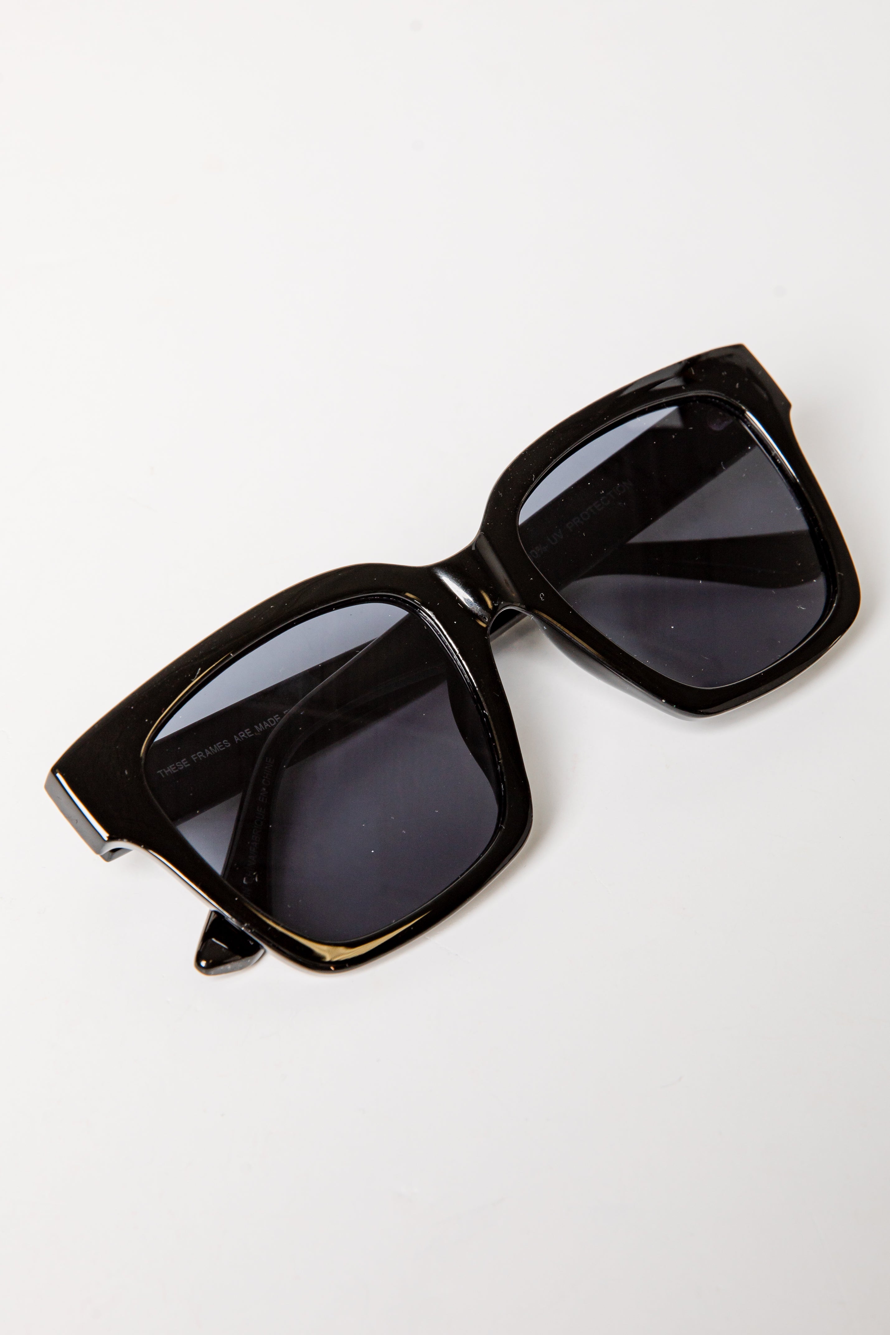 Black sunglasses on a white background