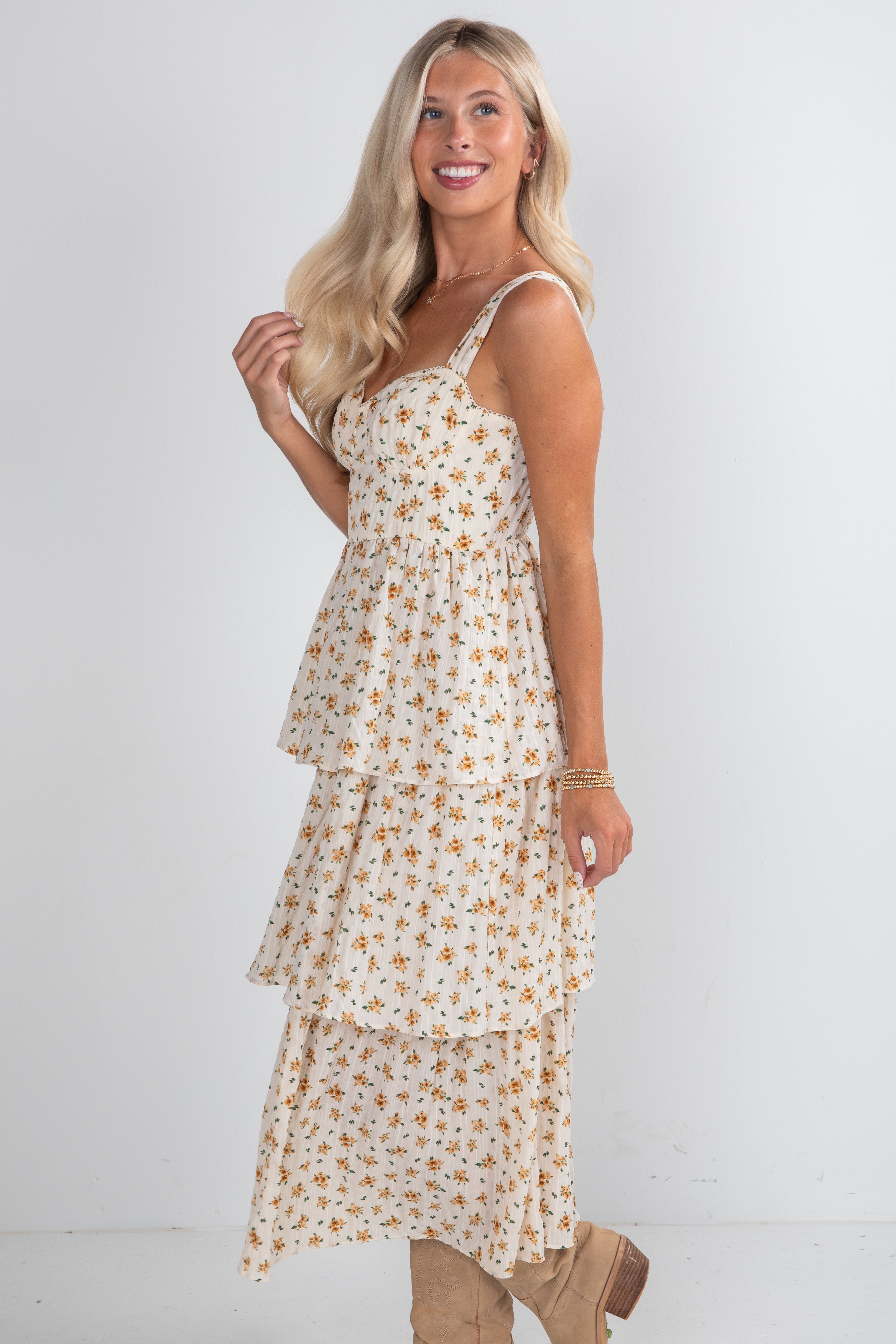 Woman wearing a floral dress against a white background