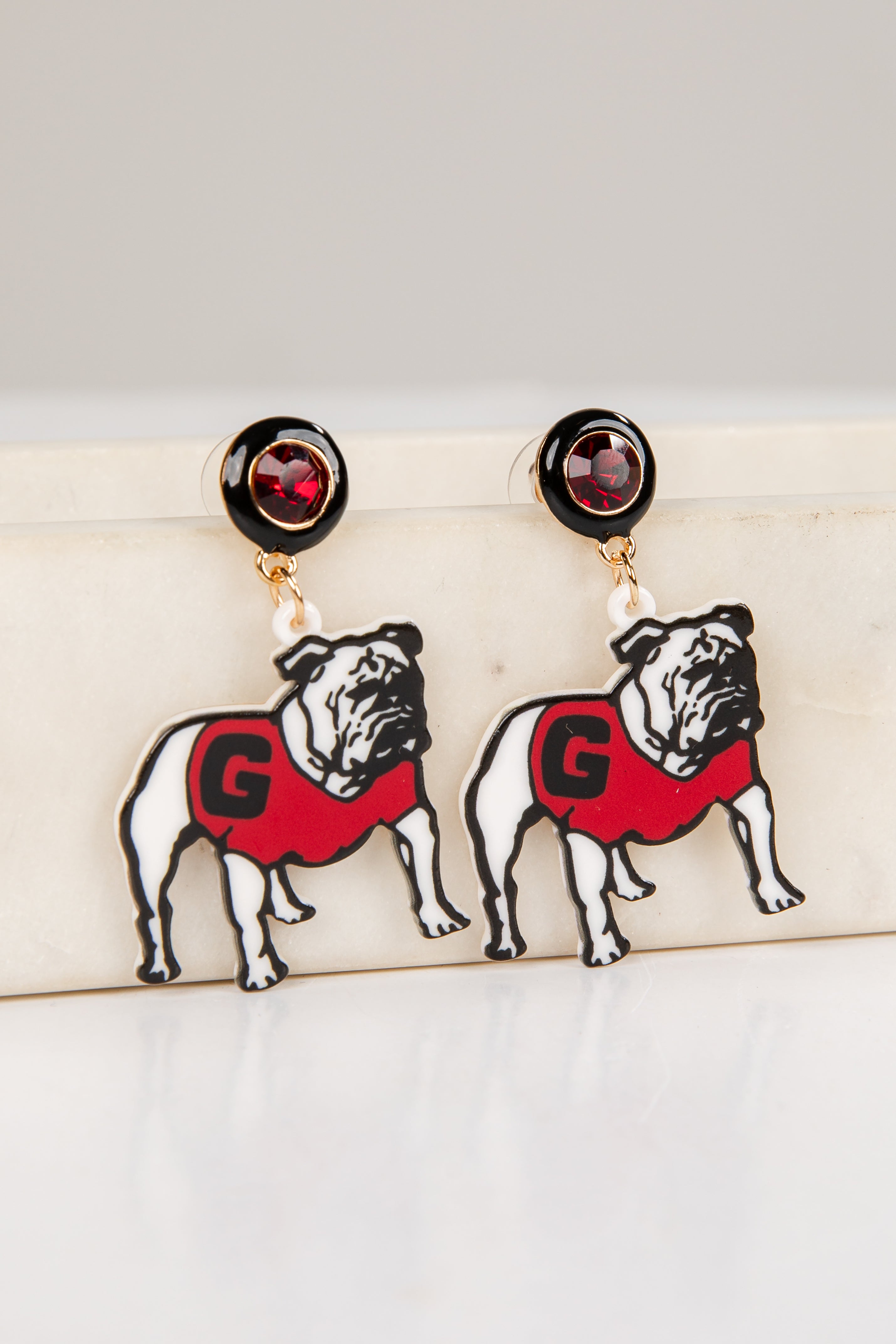 Pair of bulldog earrings with red &