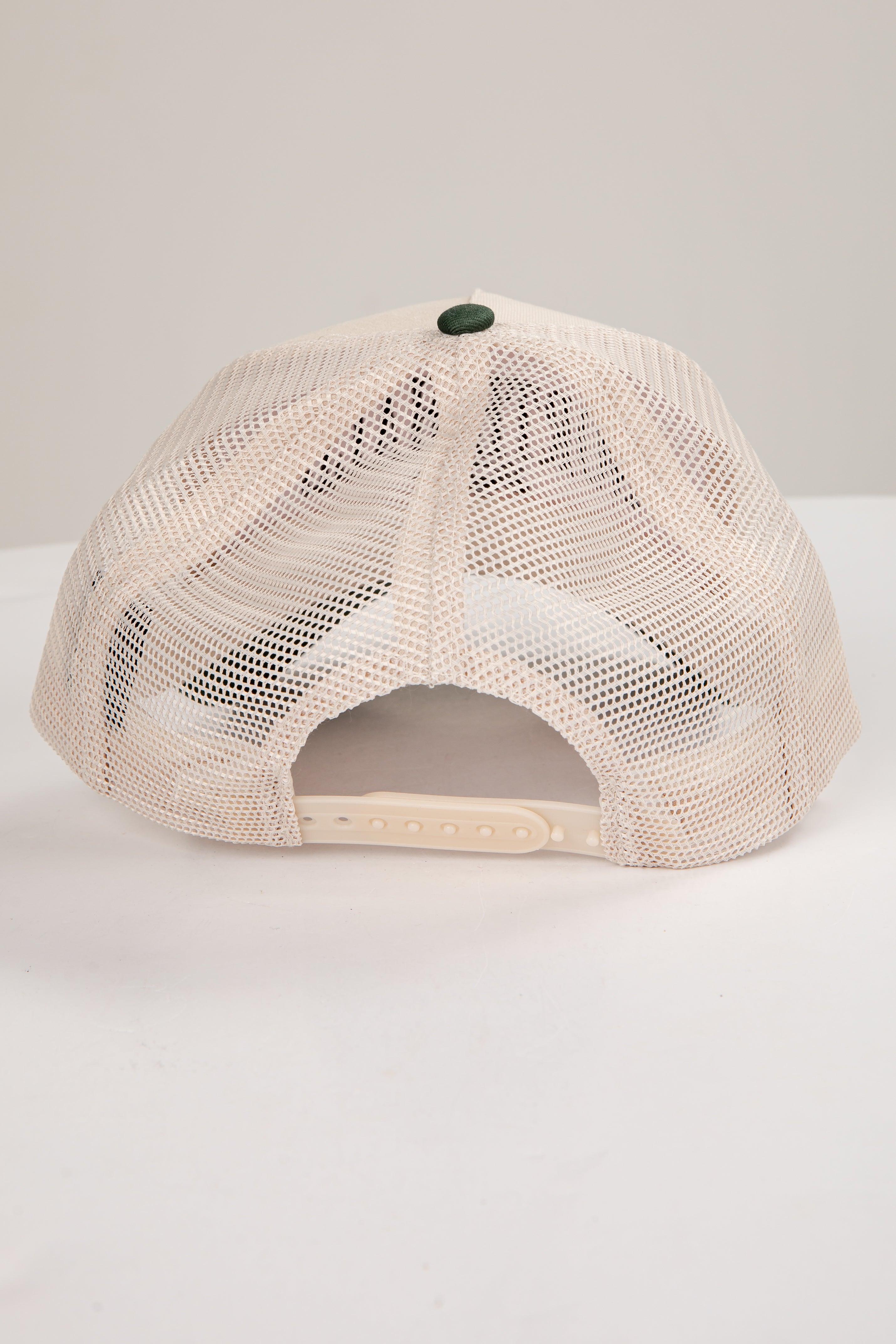 Beige mesh cap on a white background
