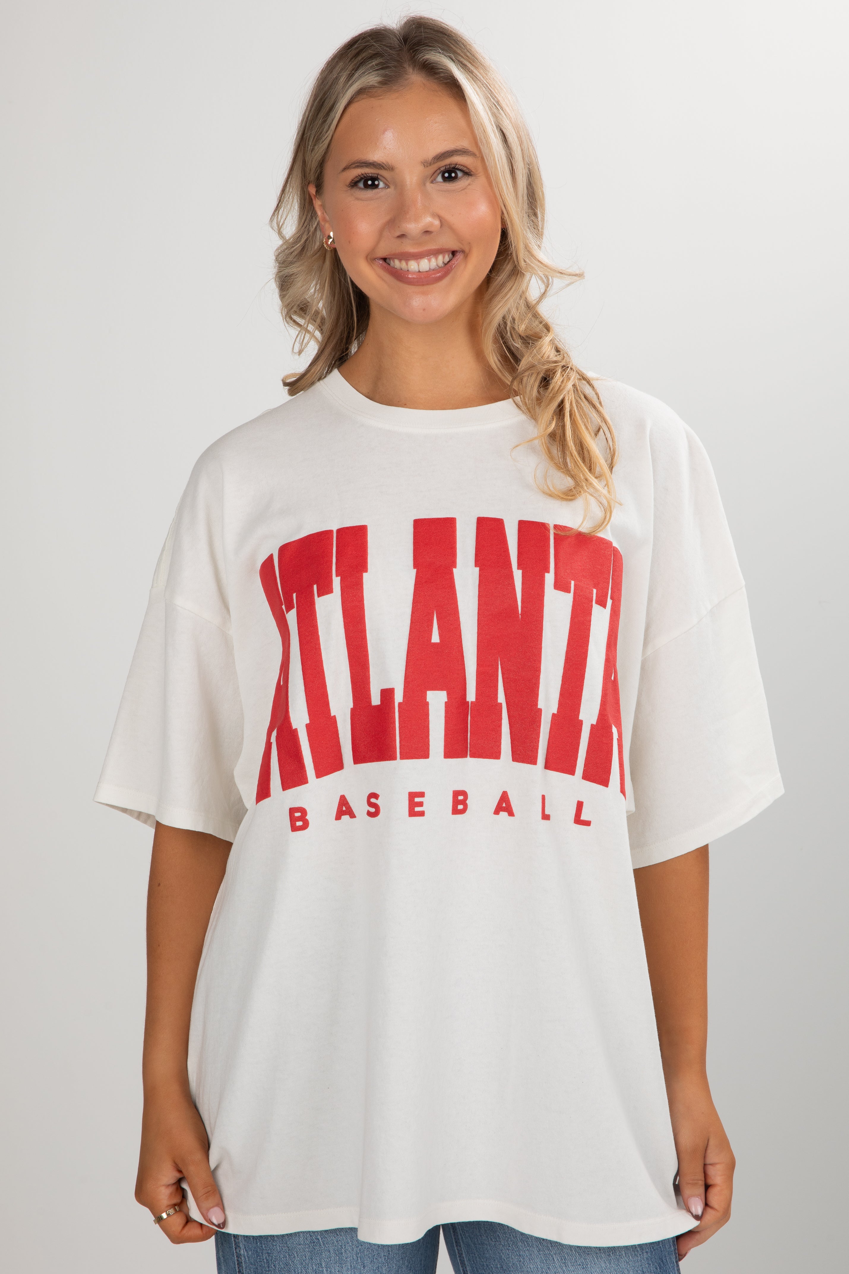 Woman wearing a white t-shirt with &