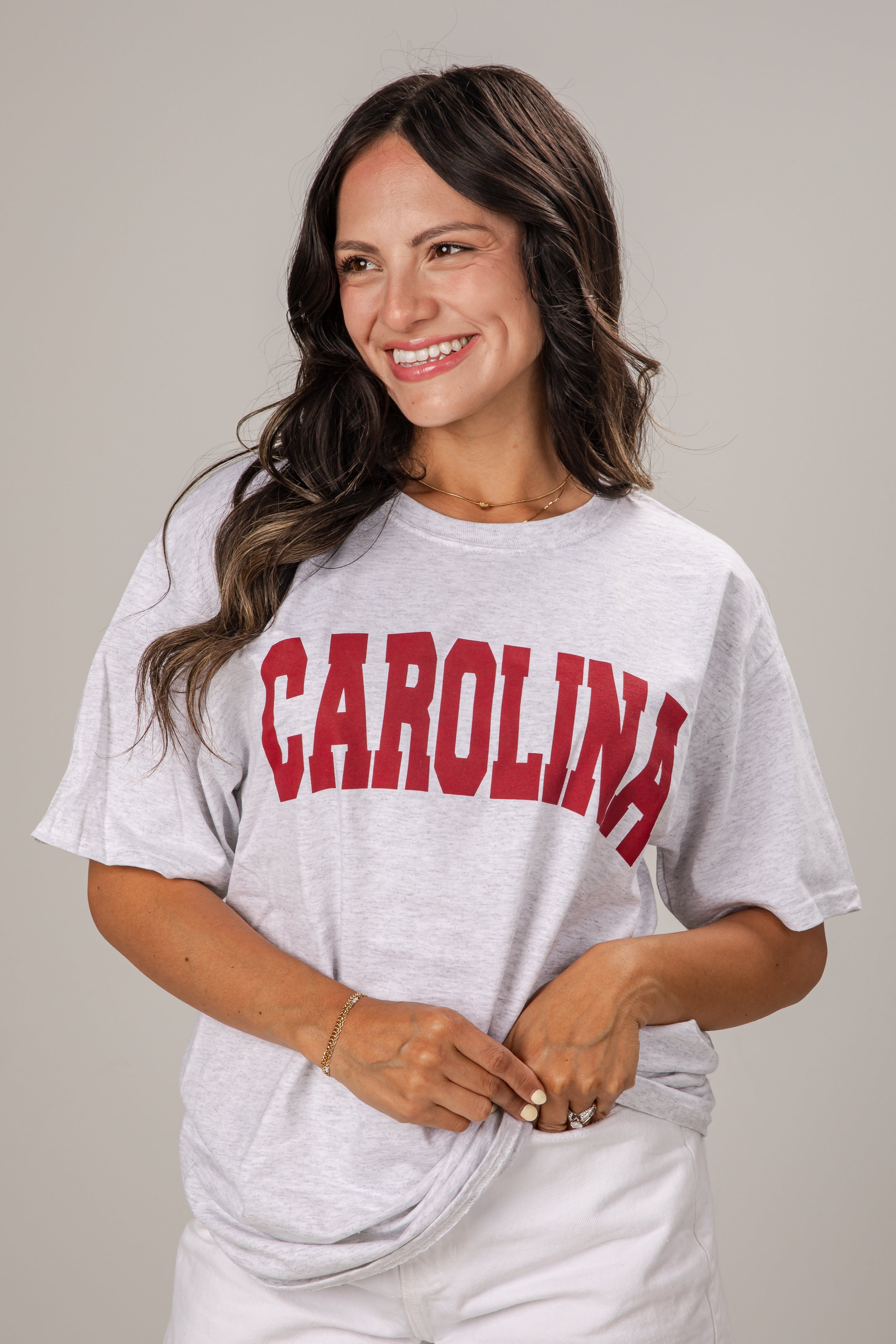 Woman wearing a gray t-shirt with &