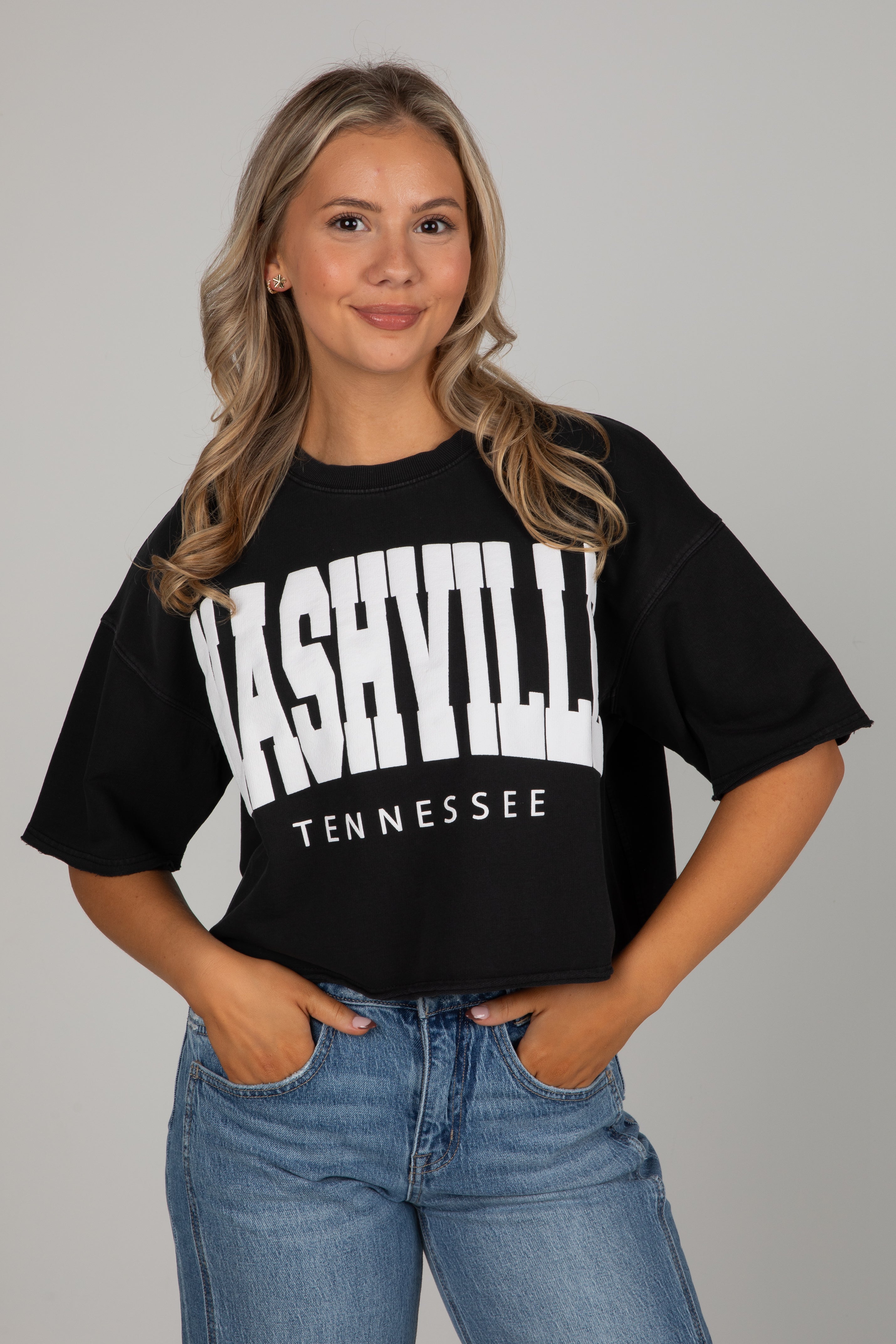 Woman wearing a black t-shirt with &