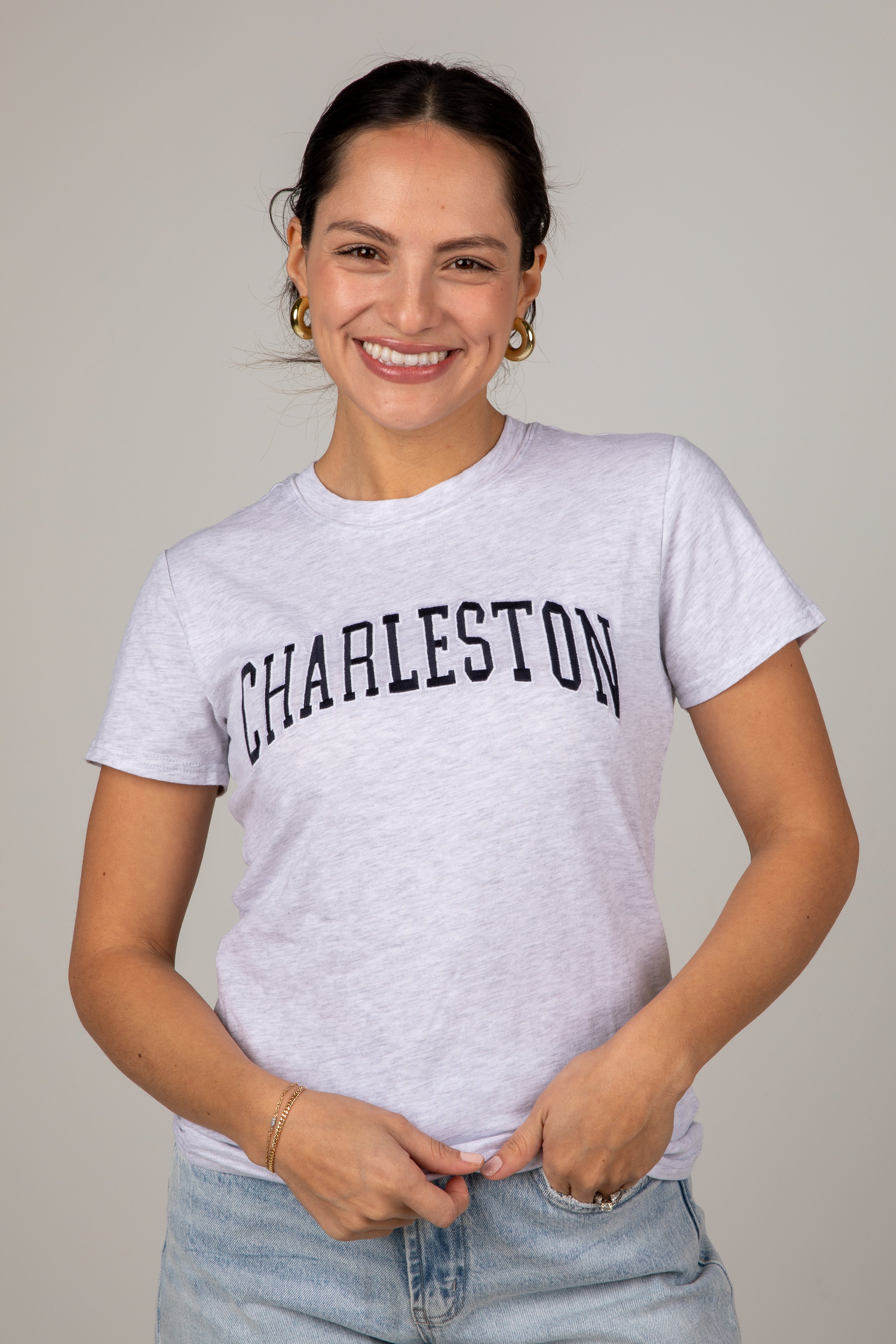 Woman wearing a white t-shirt with &