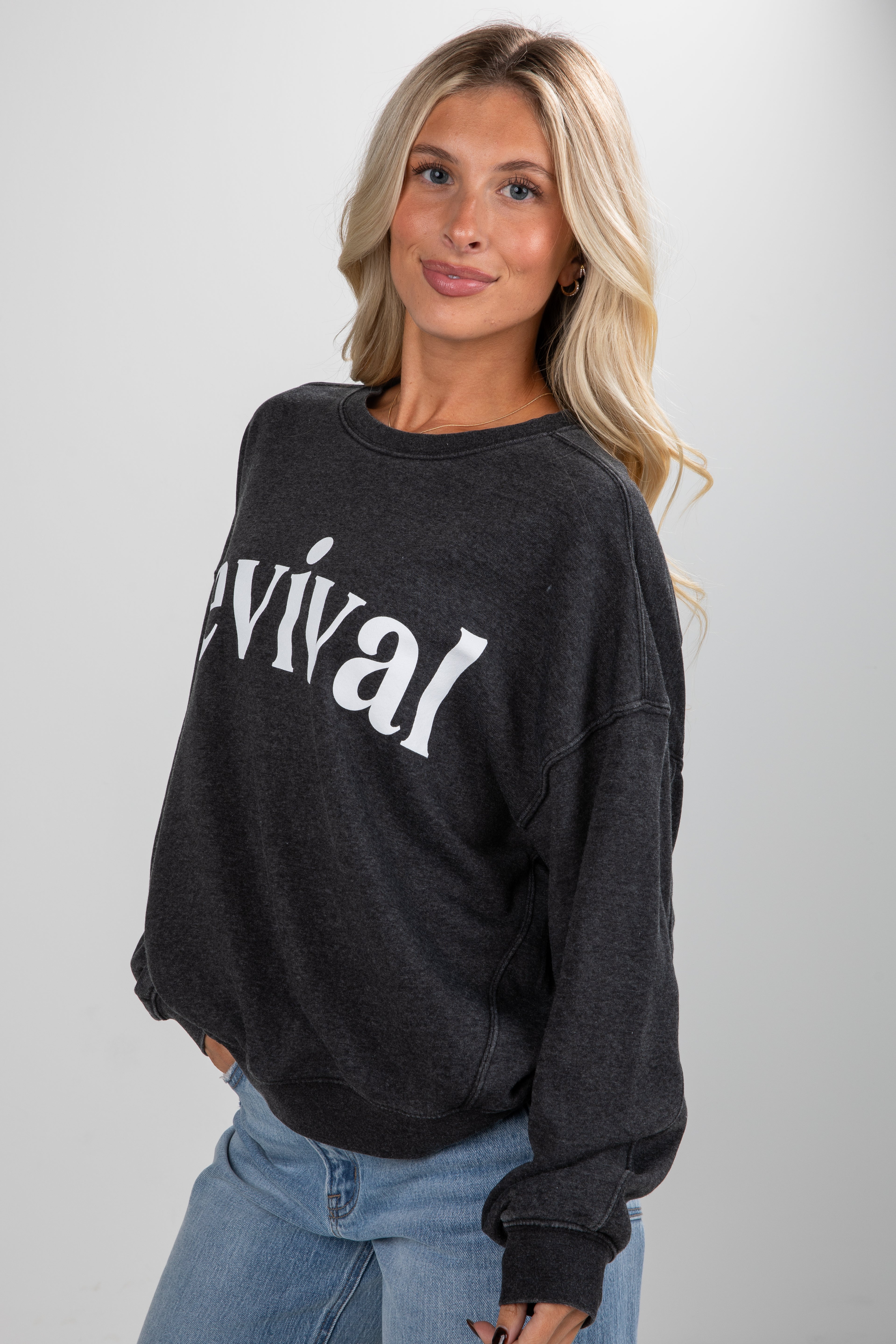 Woman wearing a black sweatshirt with &