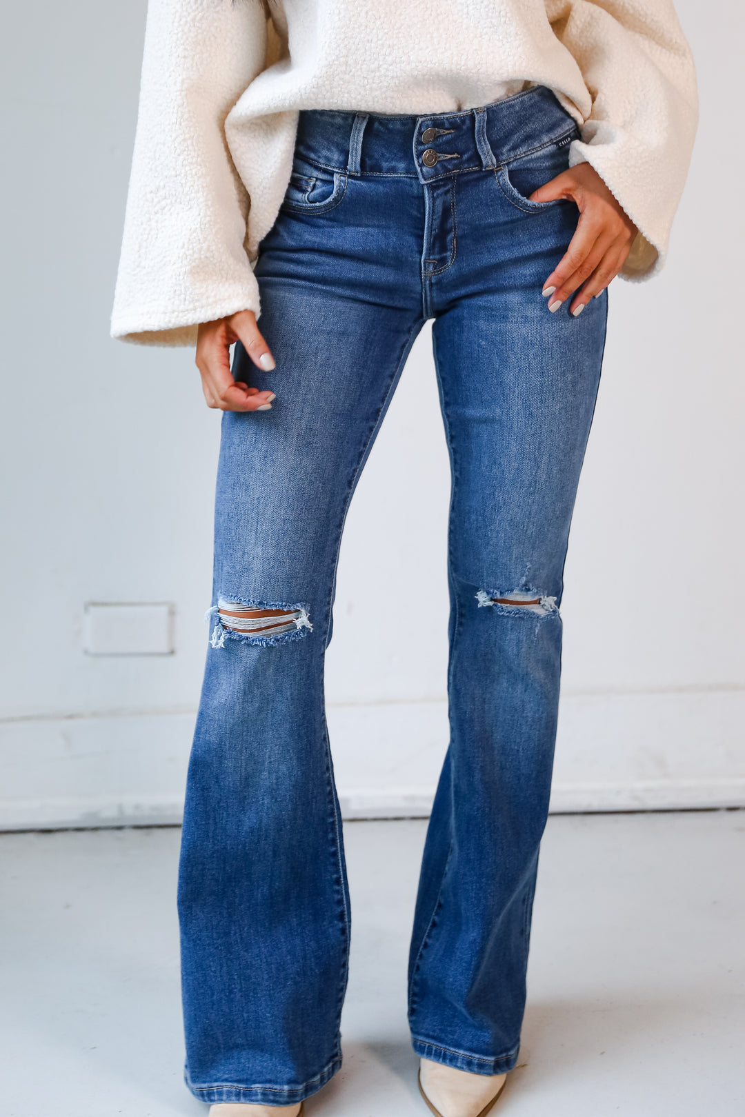 Medium Wash Distressed Flare Jeans close up