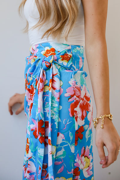 Tropical Sun Blue Floral Wrap Midi Skirt Blue Floral Wrap Midi Skirt on model
