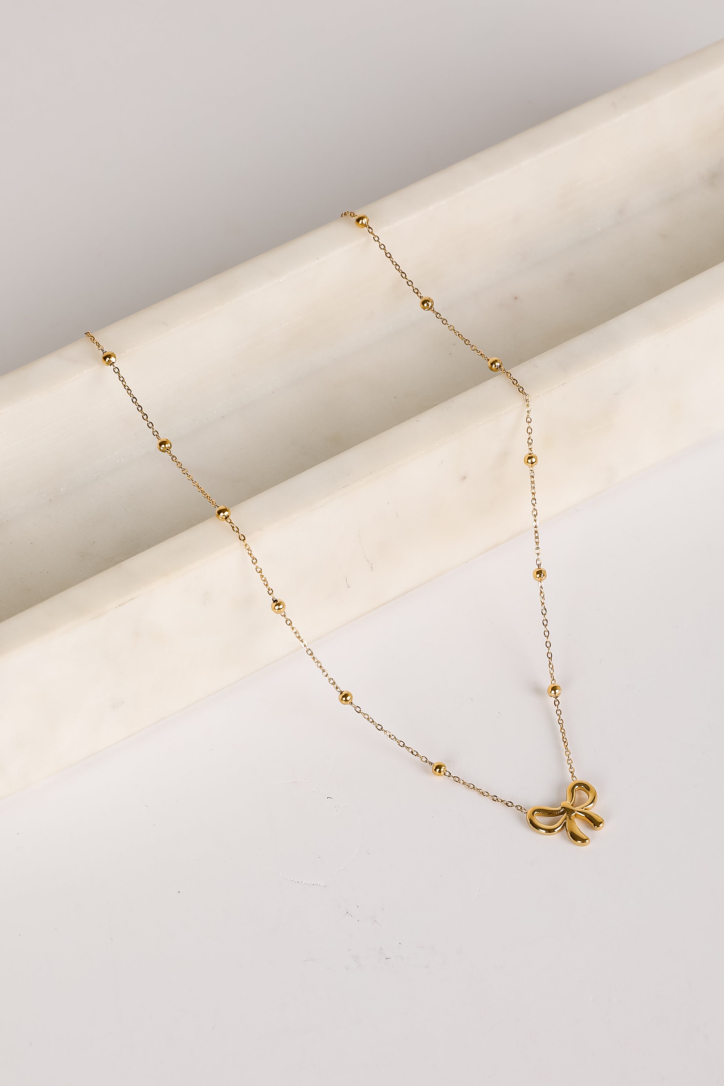 Elizabeth Gold Bow Charm Necklace