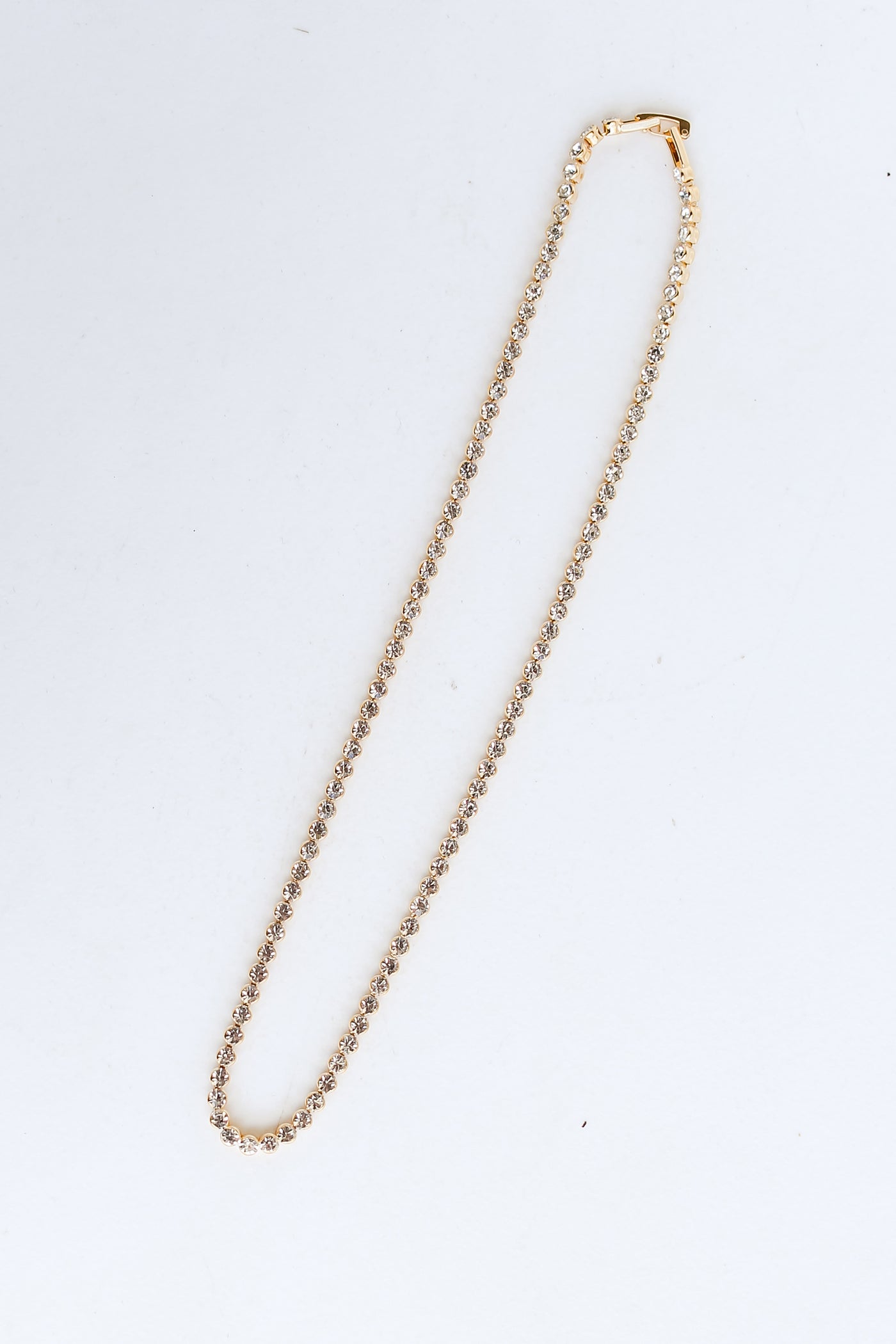 Gold Rhinestone Necklace flat lay
