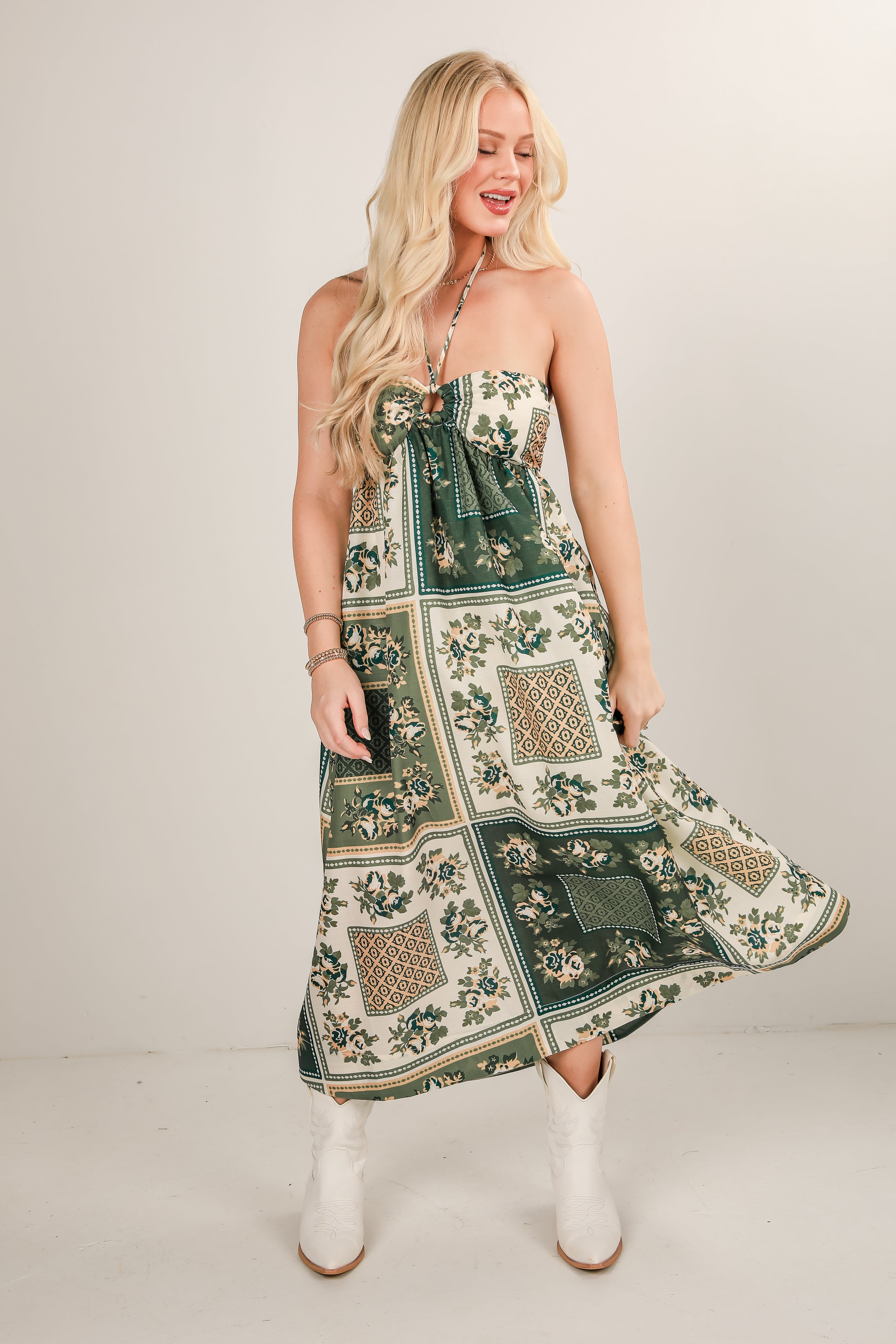 Woman wearing a floral dress with a white background