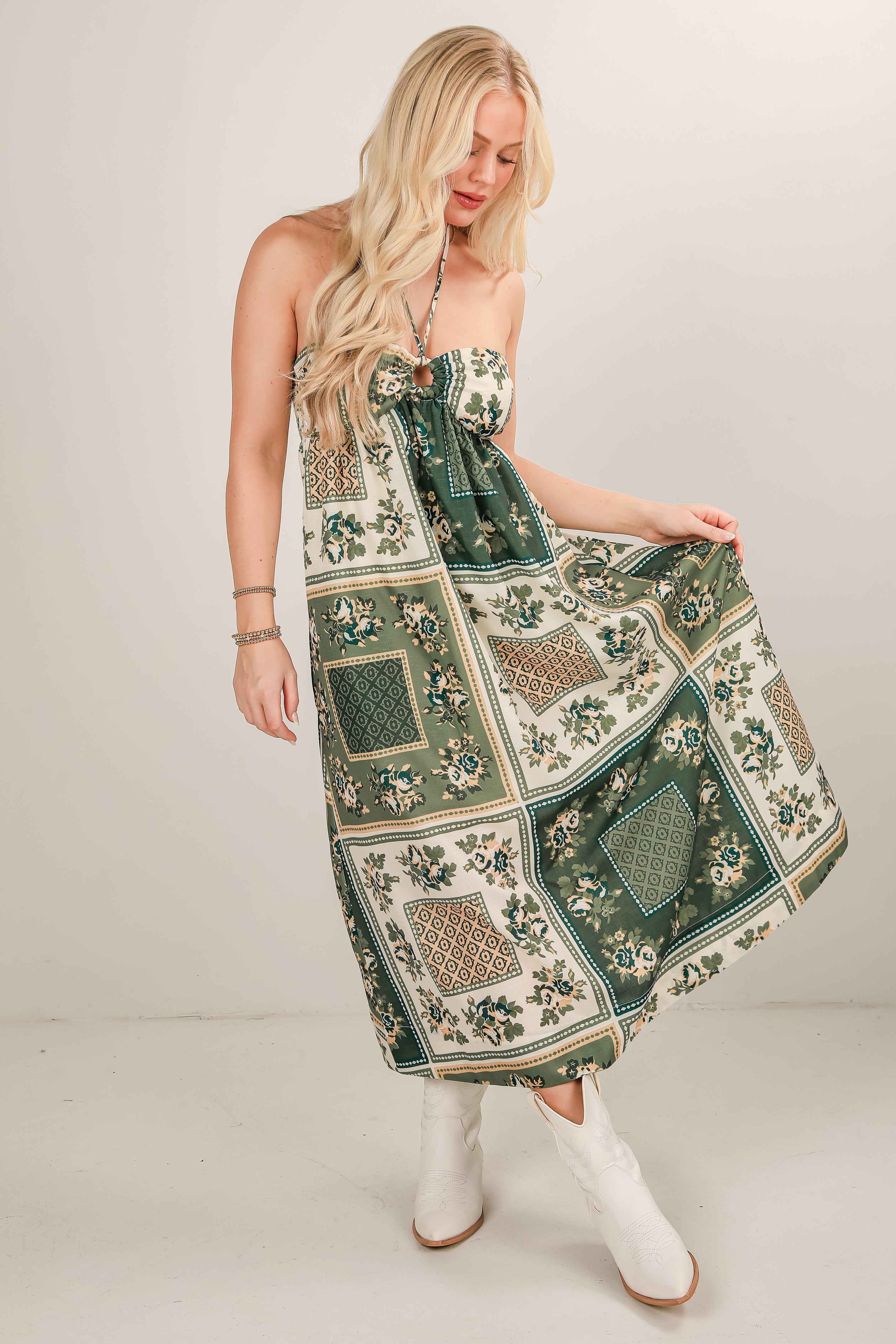 Woman wearing a patterned dress with a plain background