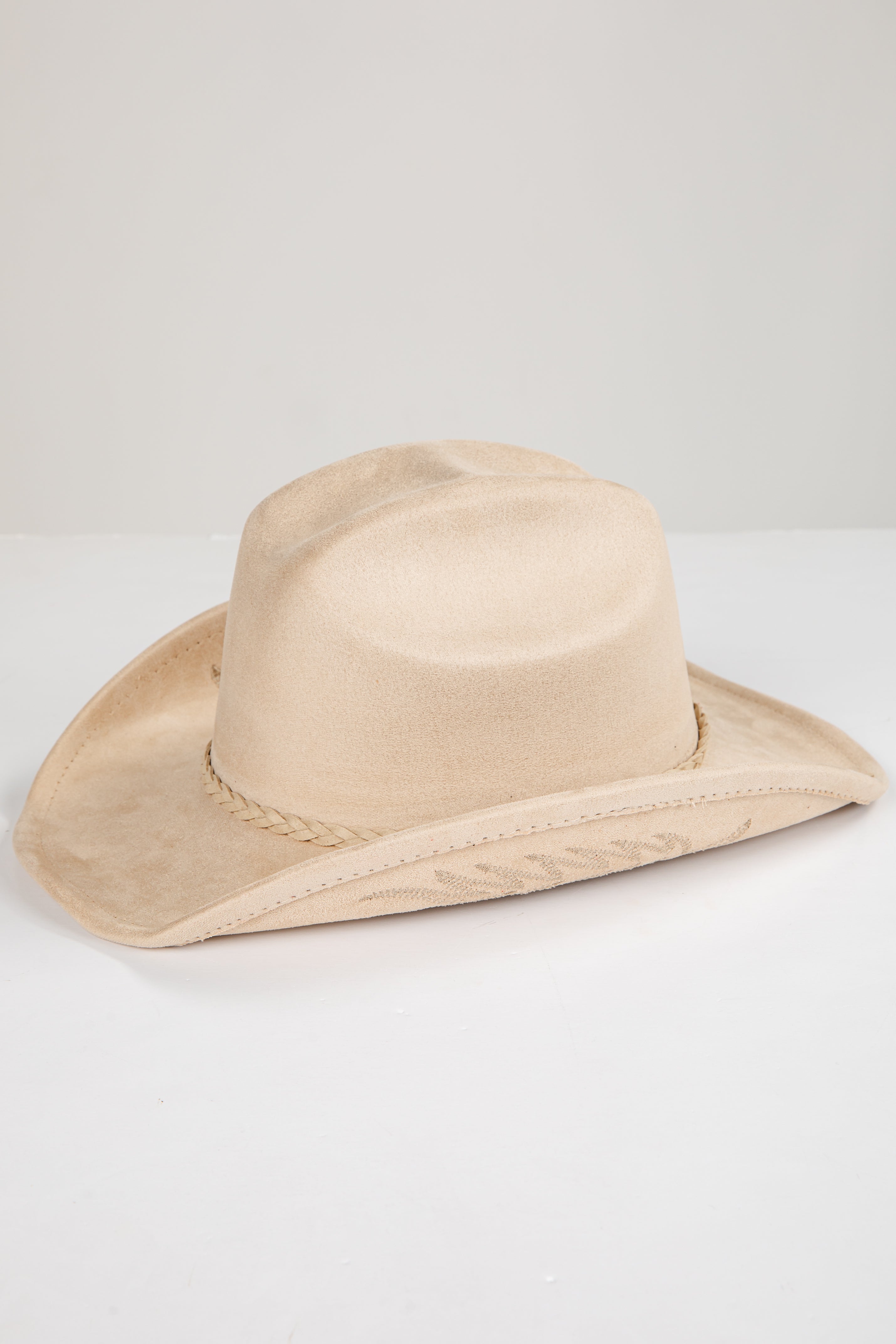 Beige cowboy hat on a white background