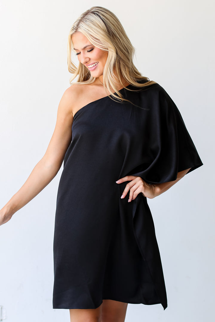 black One-Shoulder Mini Dress on model. Cute women's dress. Little black dreee
