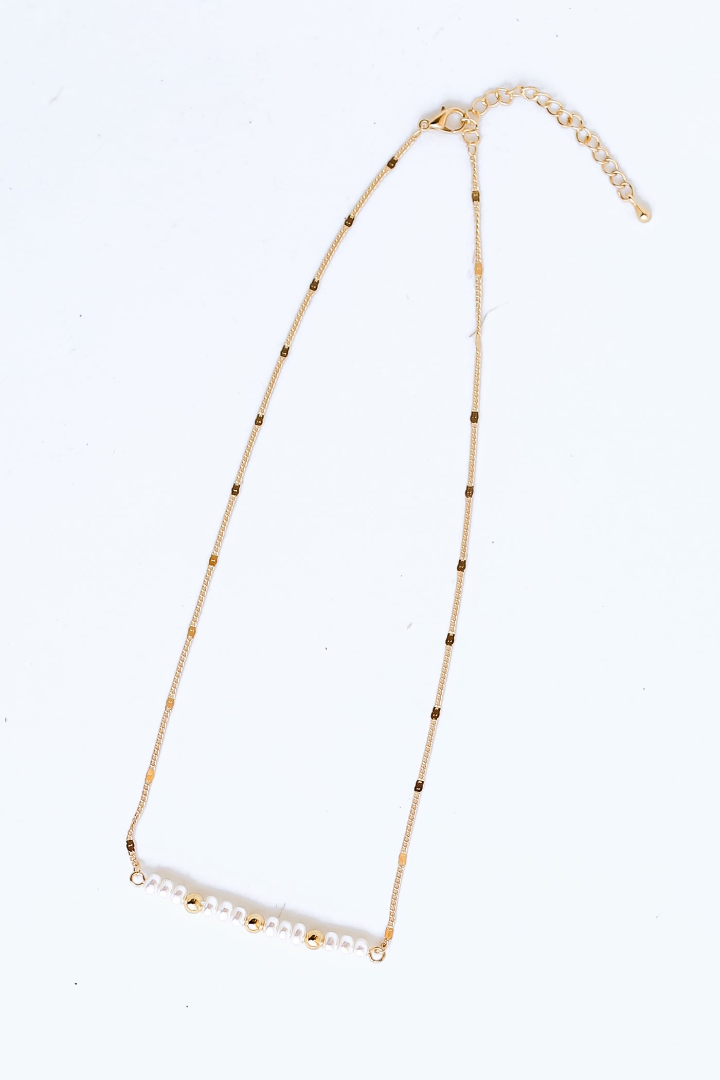 Gold Pearl Bar Necklace flat lay