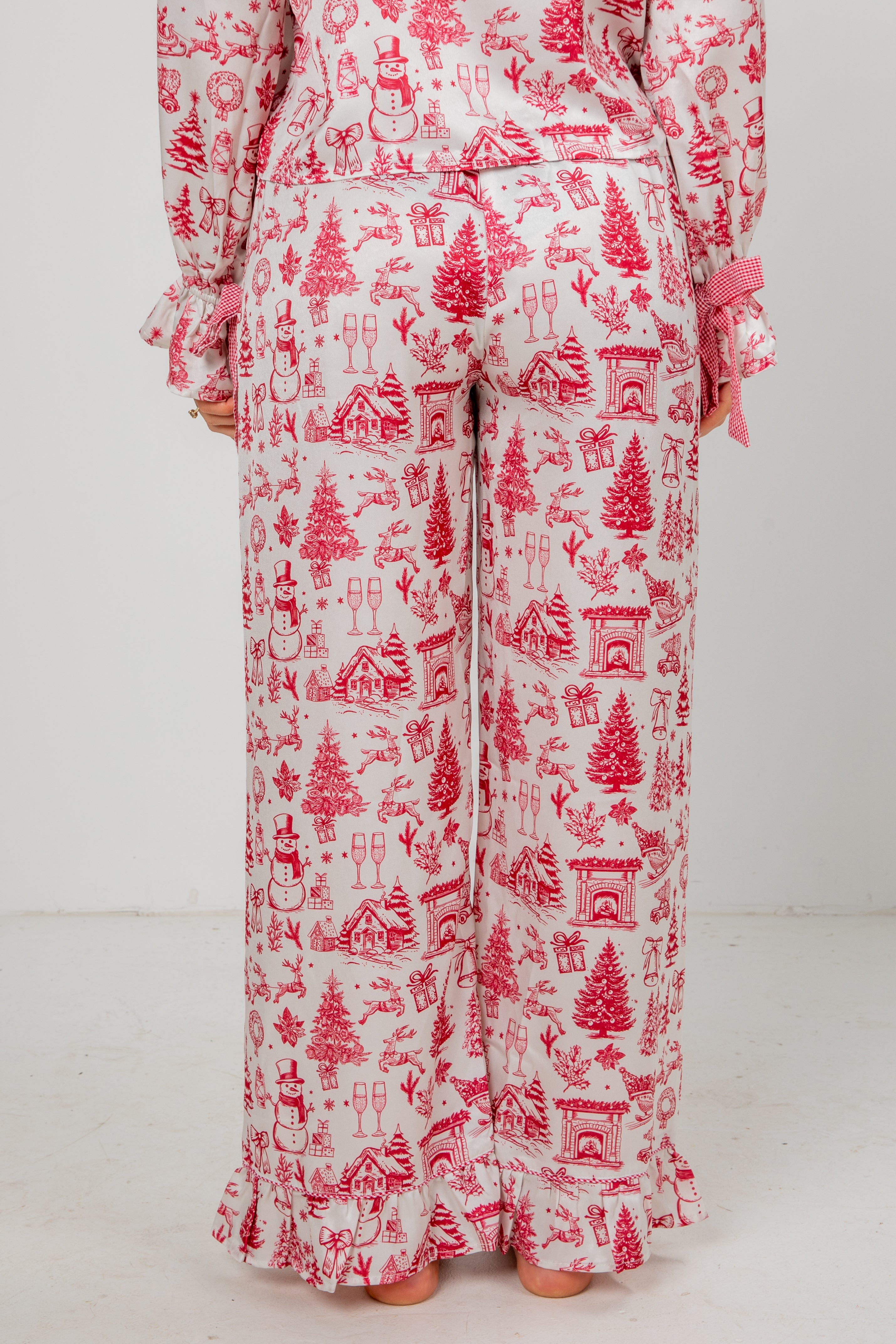 Red and white patterned pajama set on a plain background