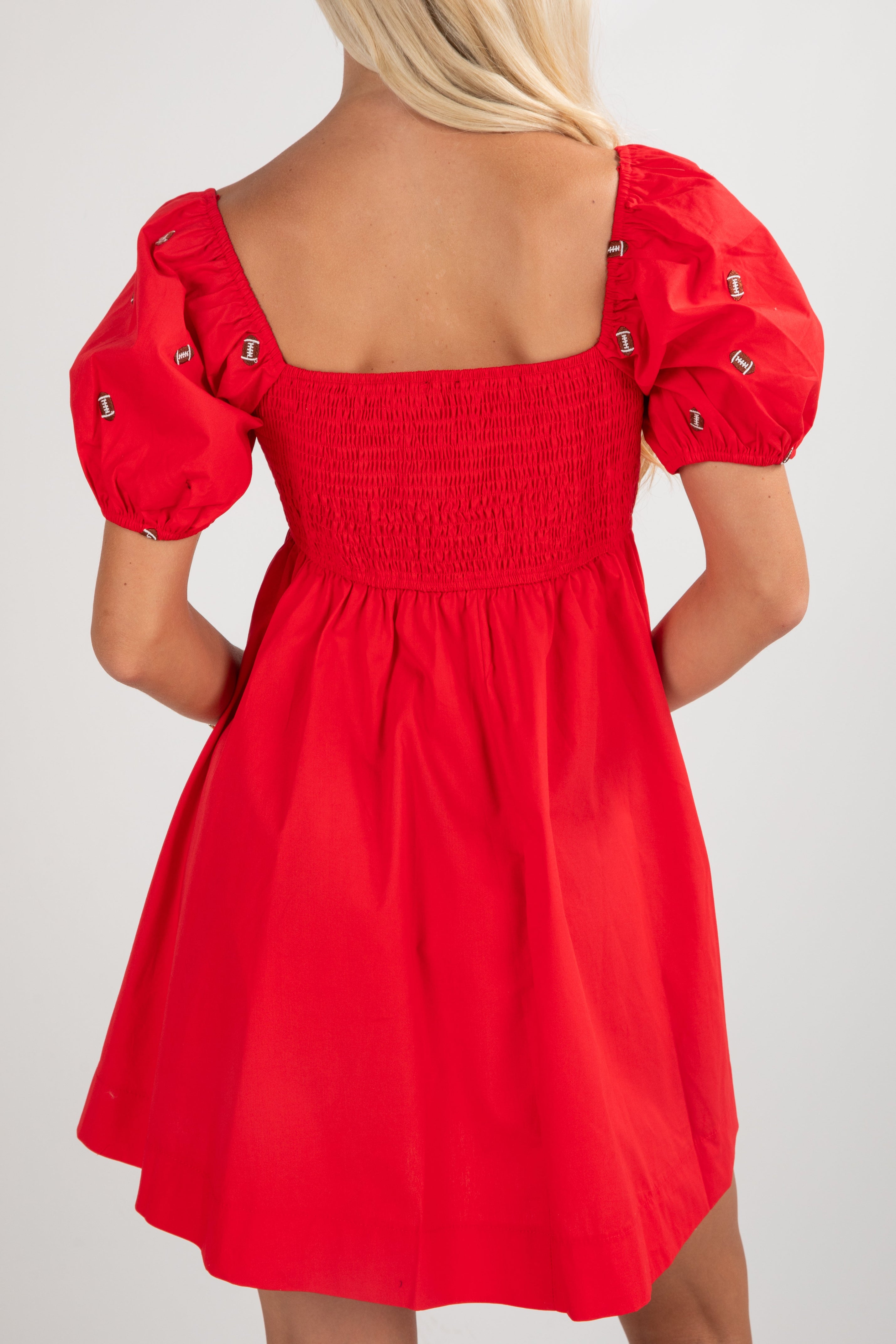 Red dress with puff sleeves on a white background