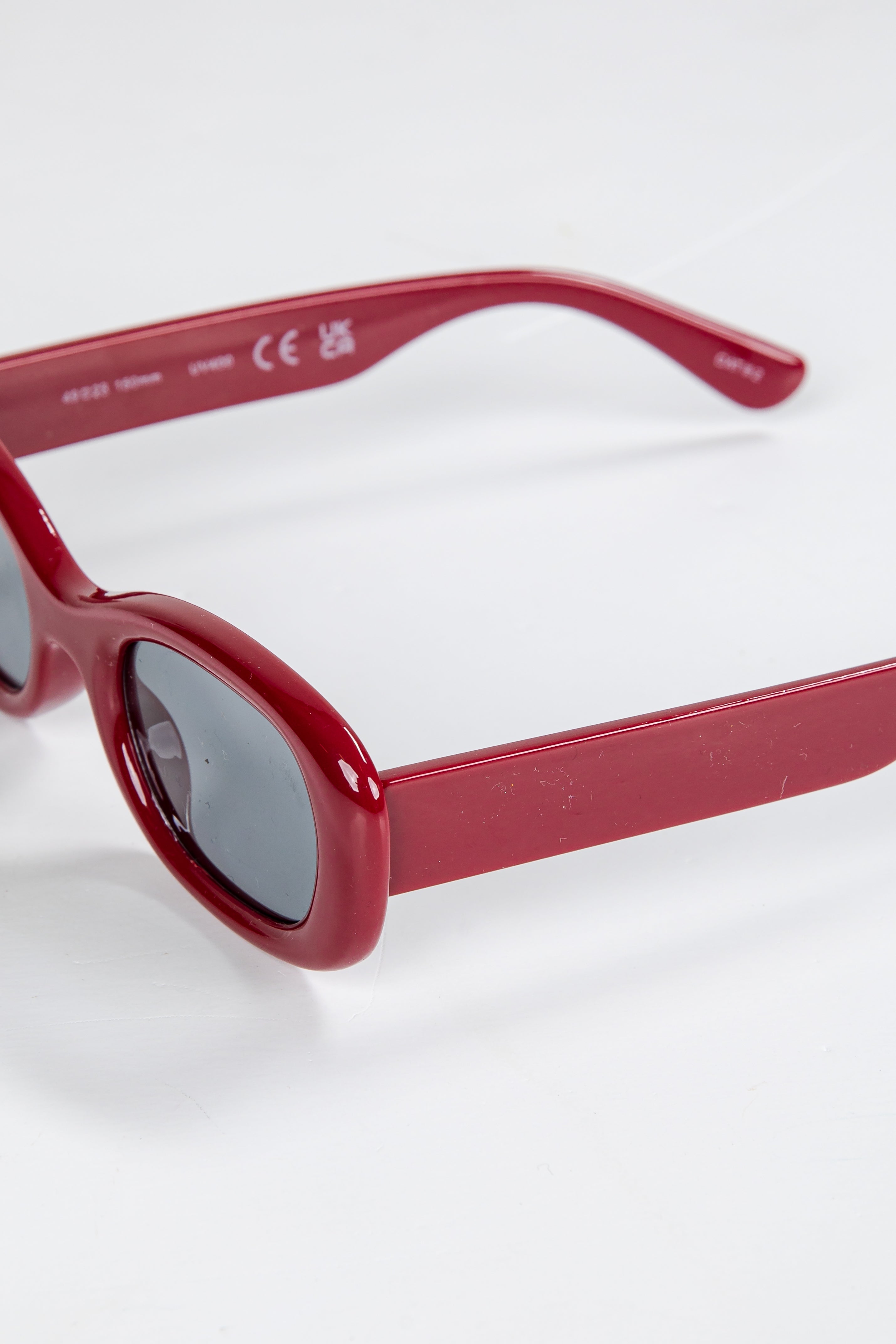 Red sunglasses on a white background