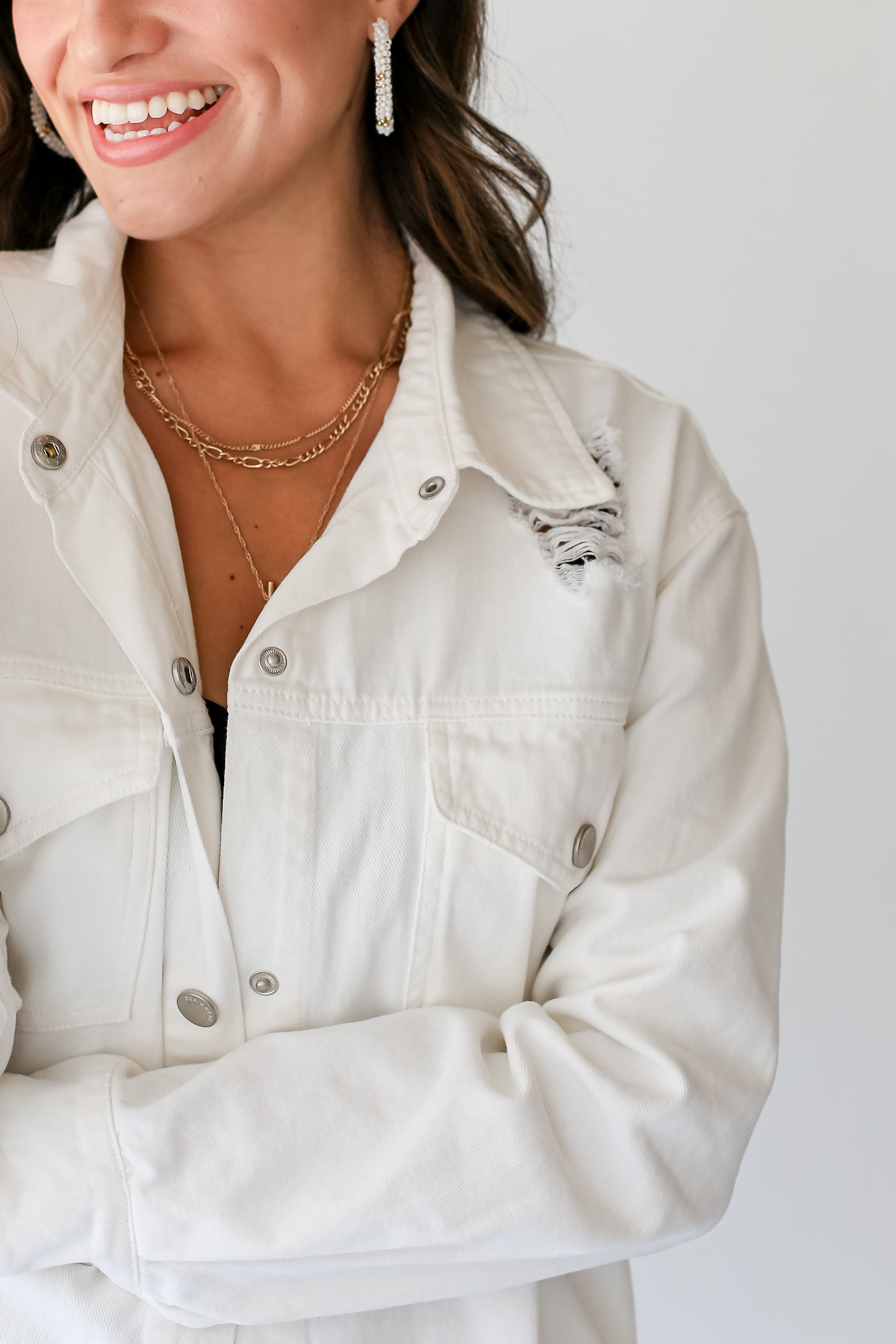 White Distressed Denim Jacket close up