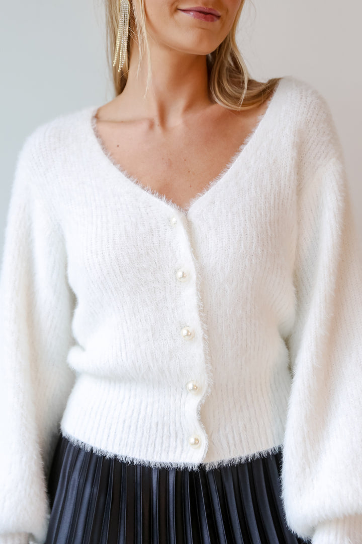 white sweaters