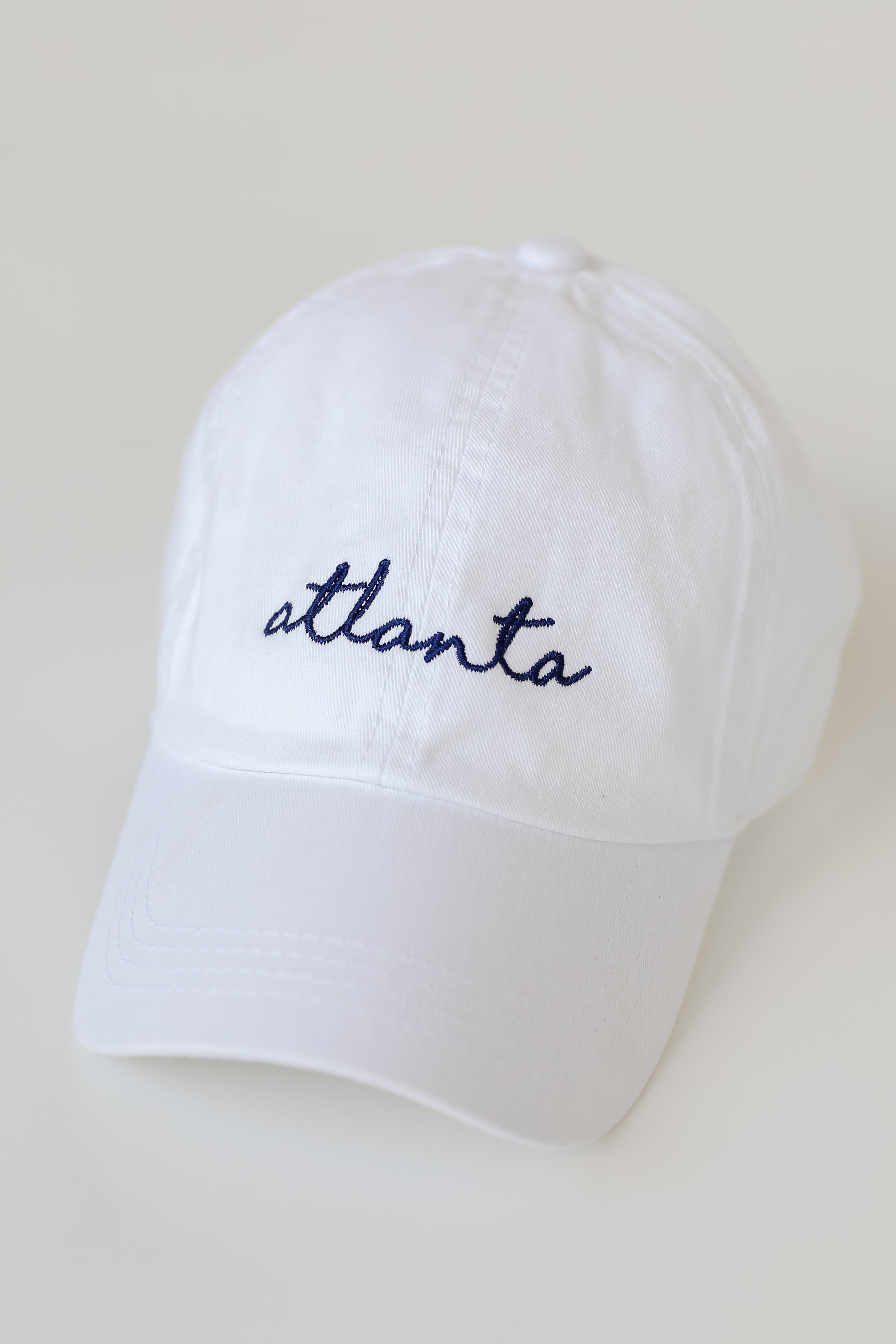 Atlanta Script Embroidered Hat in white flat lay