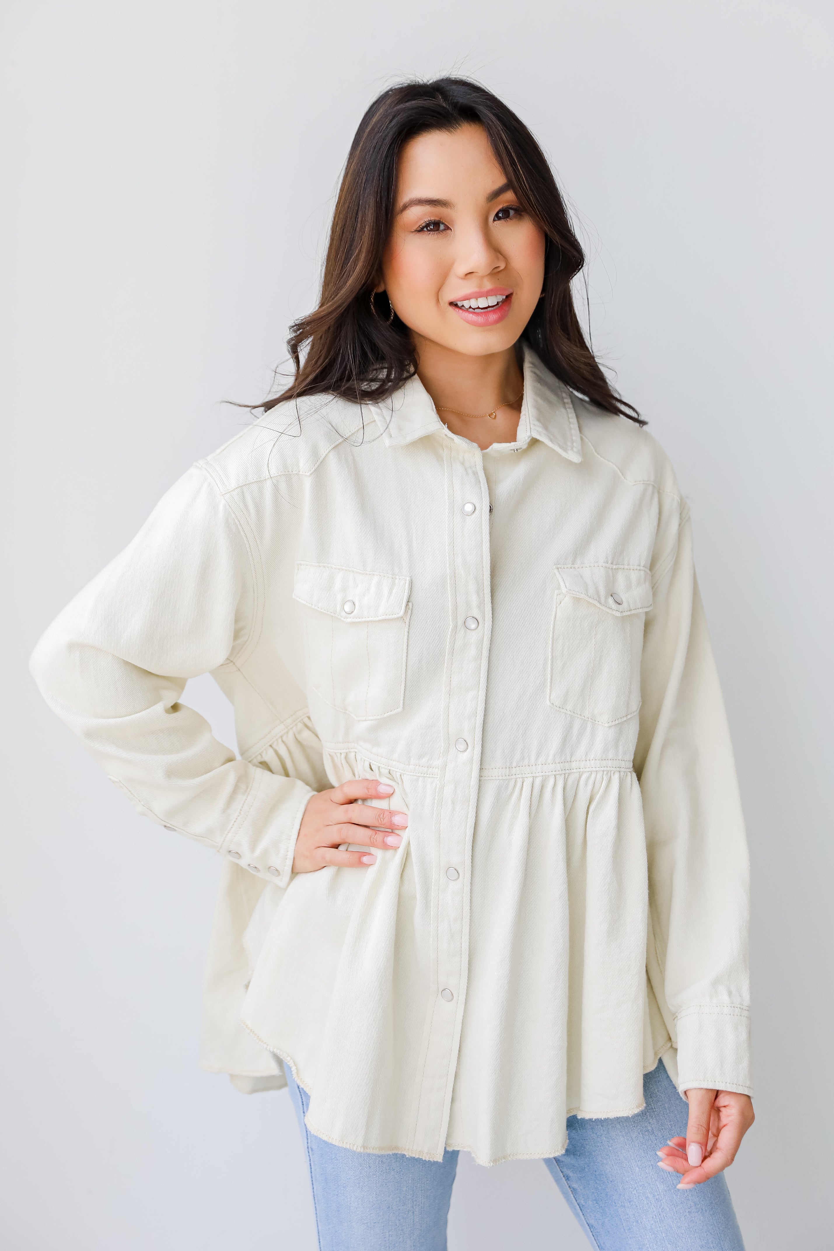Peplum Denim Jacket in ivory on model