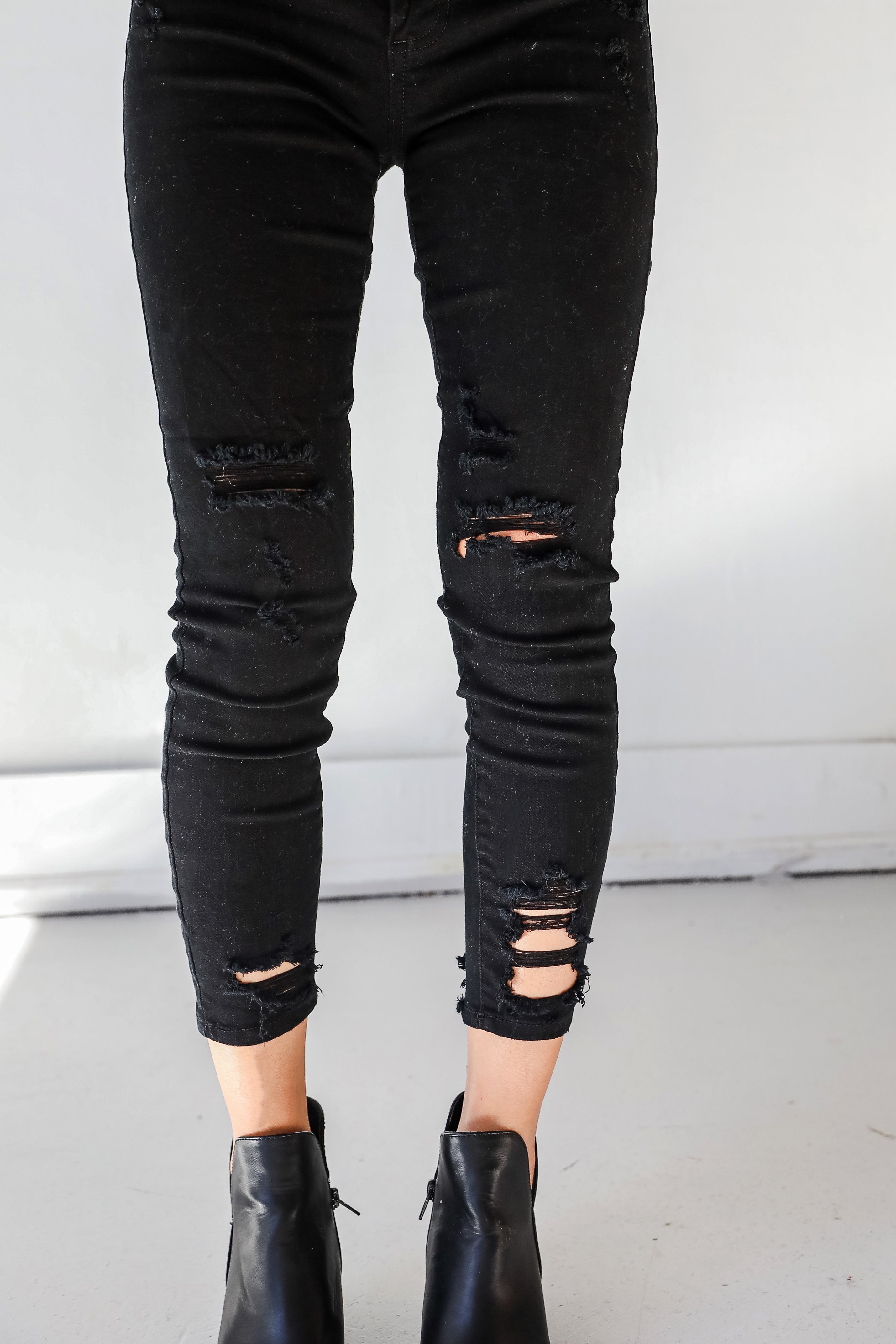 Distressed Black Skinny Jeans close up