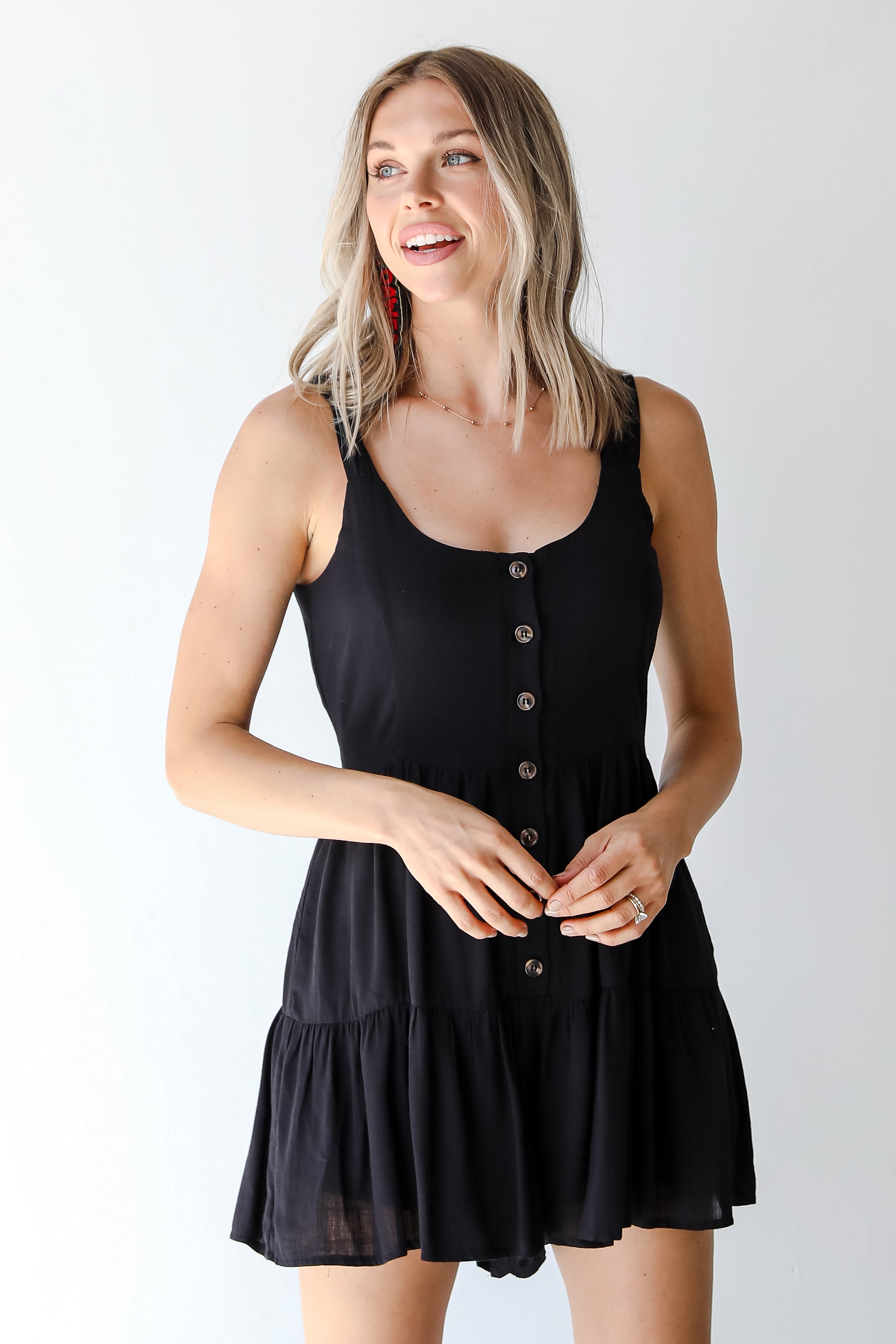 model wearing a black romper