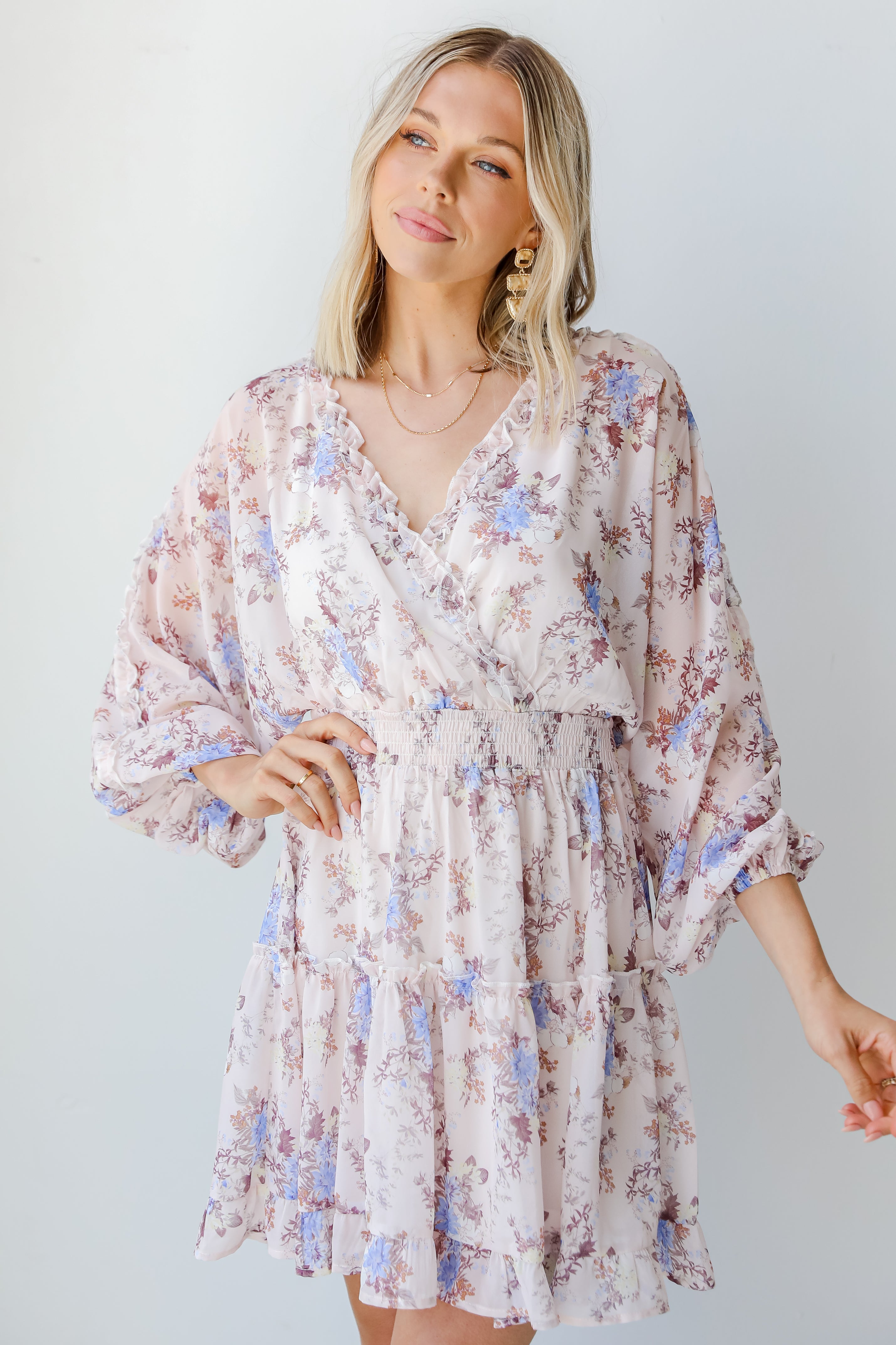 model wearing a blush Floral Mini Dress