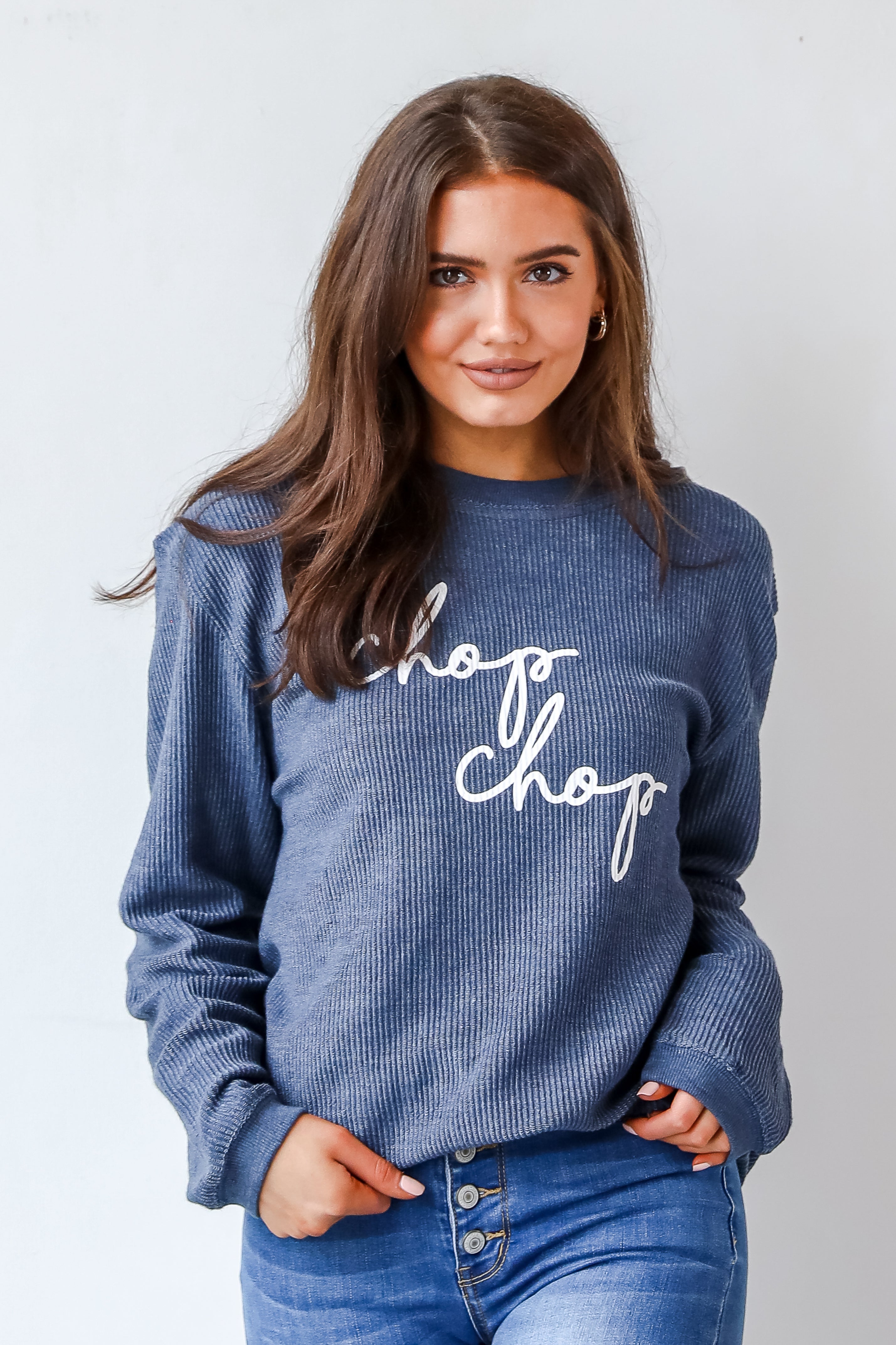 This comfy sweatshirt is designed with a soft and stretchy corded knit. It features a crew neckline, long sleeves, an oversized fit, and the words "Chop Chop" on the front.