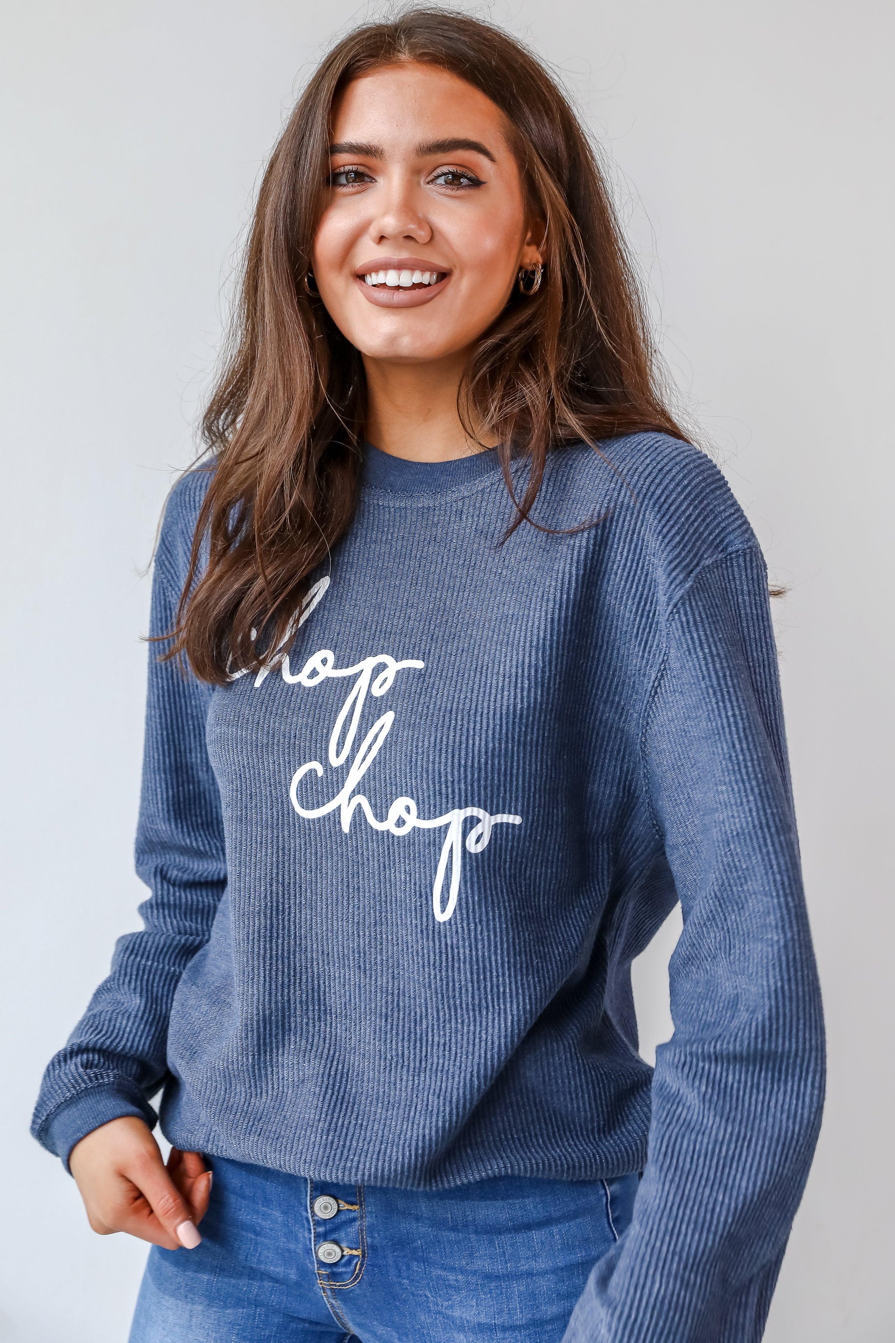This comfy sweatshirt is designed with a soft and stretchy corded knit. It features a crew neckline, long sleeves, an oversized fit, and the words "Chop Chop" on the front.