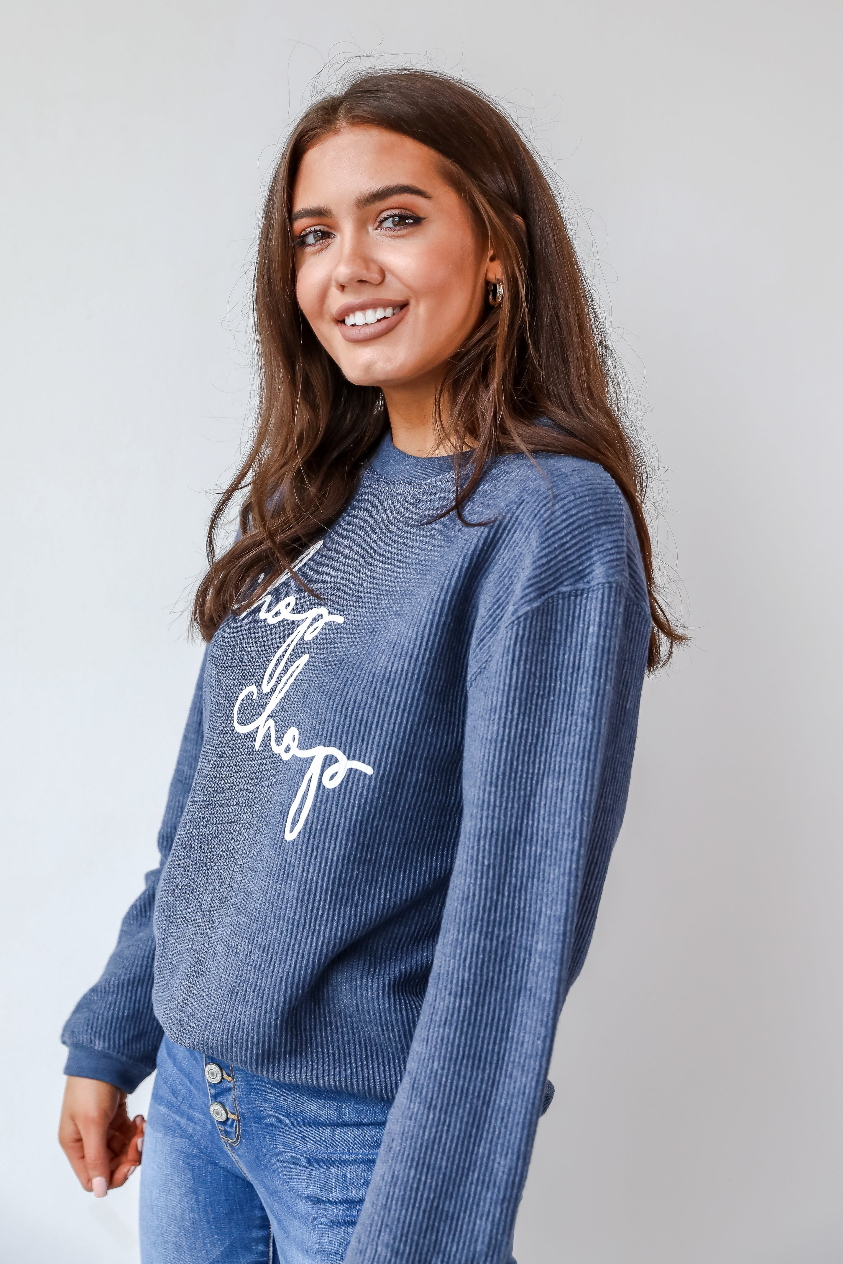 This comfy sweatshirt is designed with a soft and stretchy corded knit. It features a crew neckline, long sleeves, an oversized fit, and the words "Chop Chop" on the front.