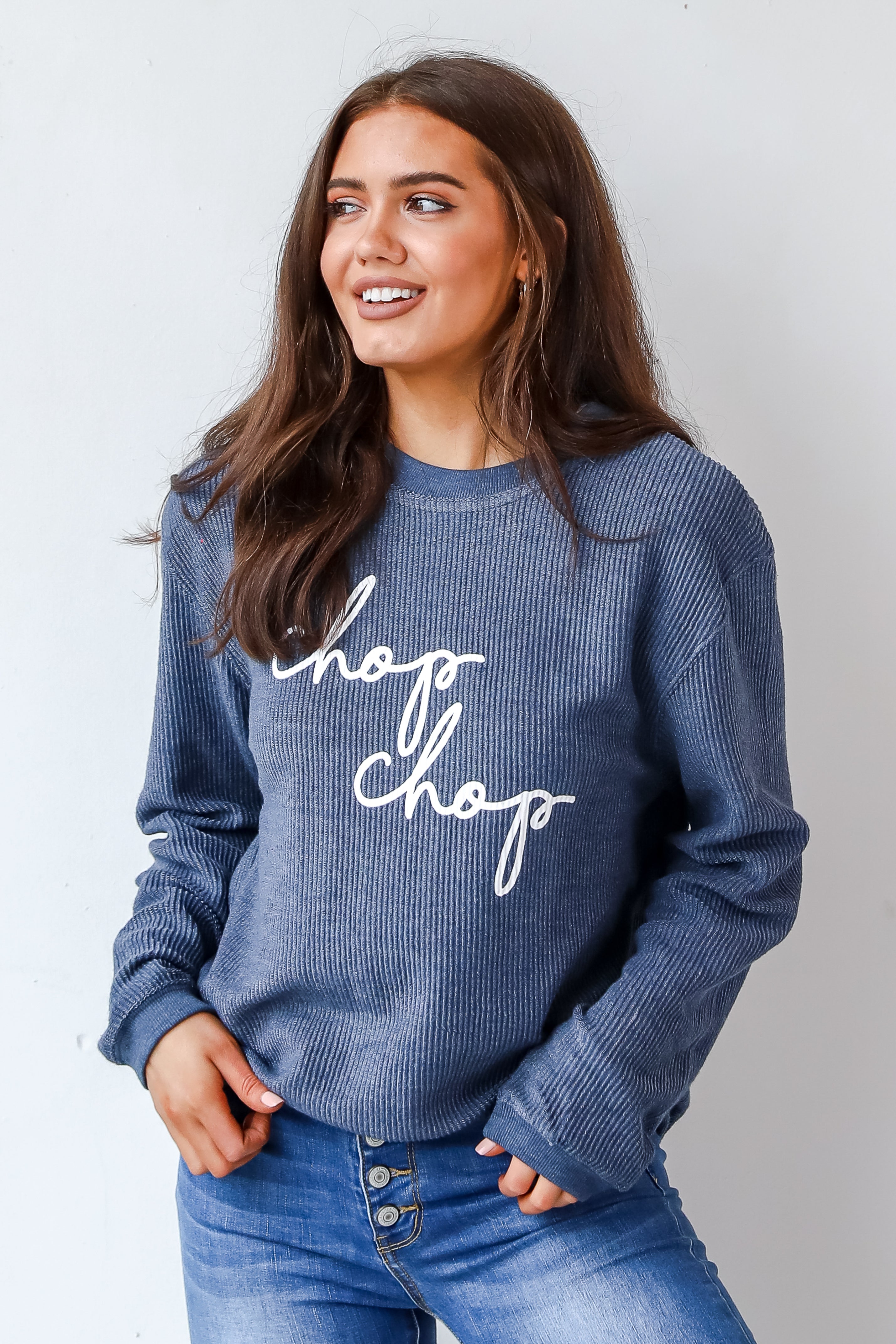 This comfy sweatshirt is designed with a soft and stretchy corded knit. It features a crew neckline, long sleeves, an oversized fit, and the words "Chop Chop" on the front.