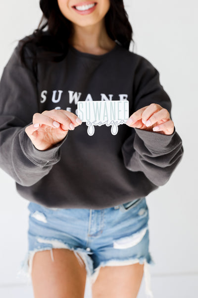 model holding the Suwanee Georgia Script Sticker