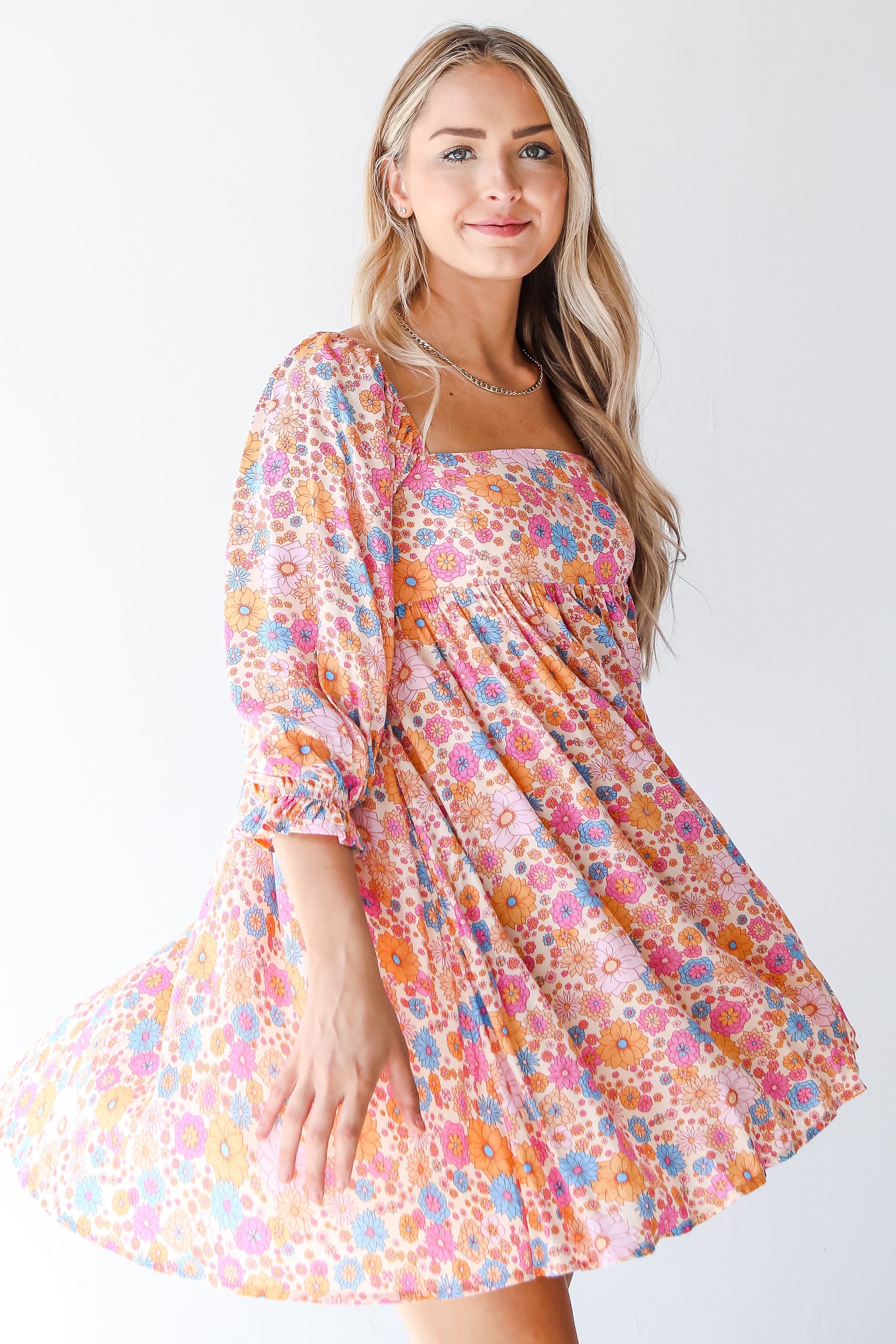 pink floral mini dress on model