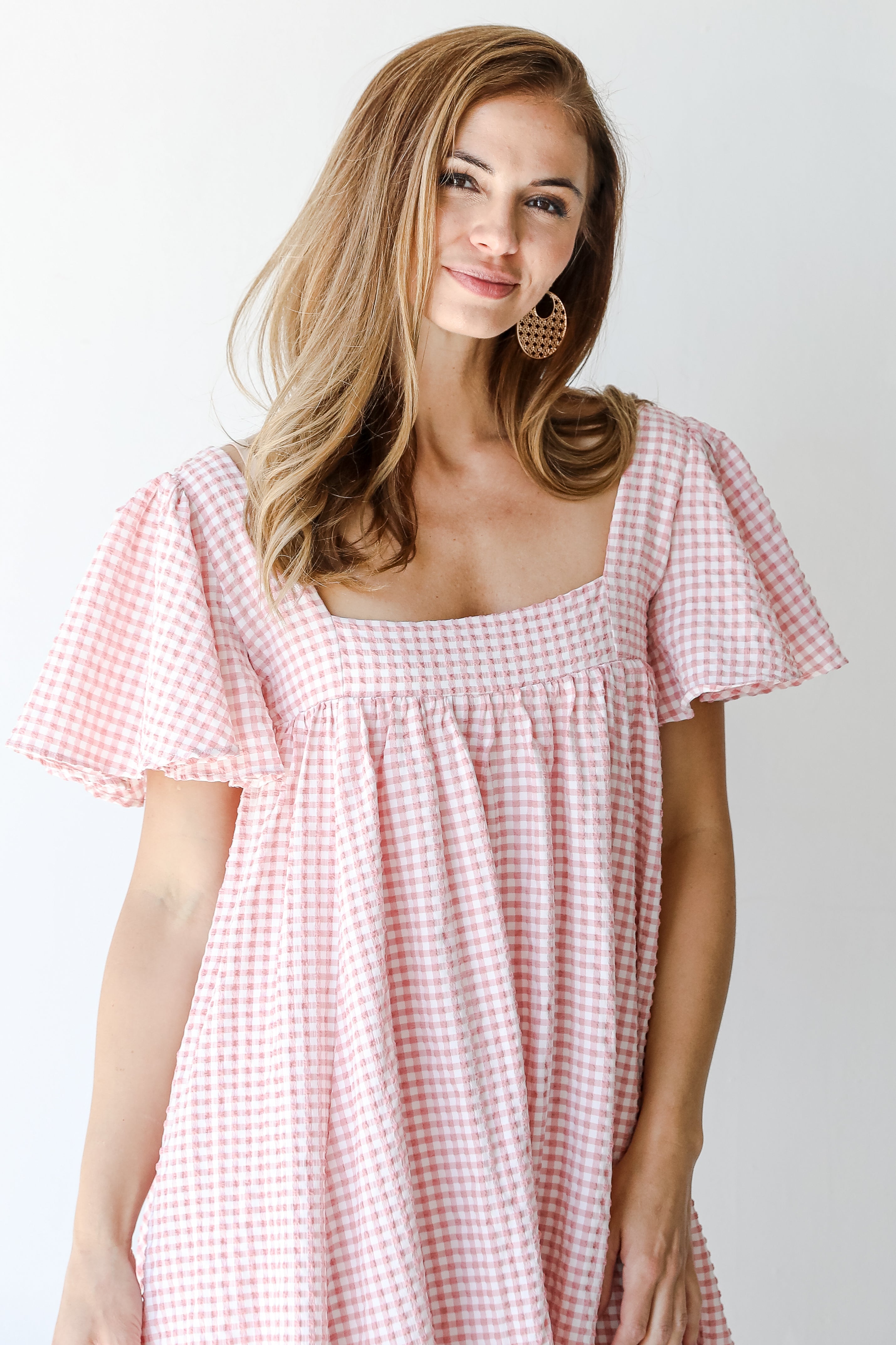 Gingham Mini Dress in blush on model