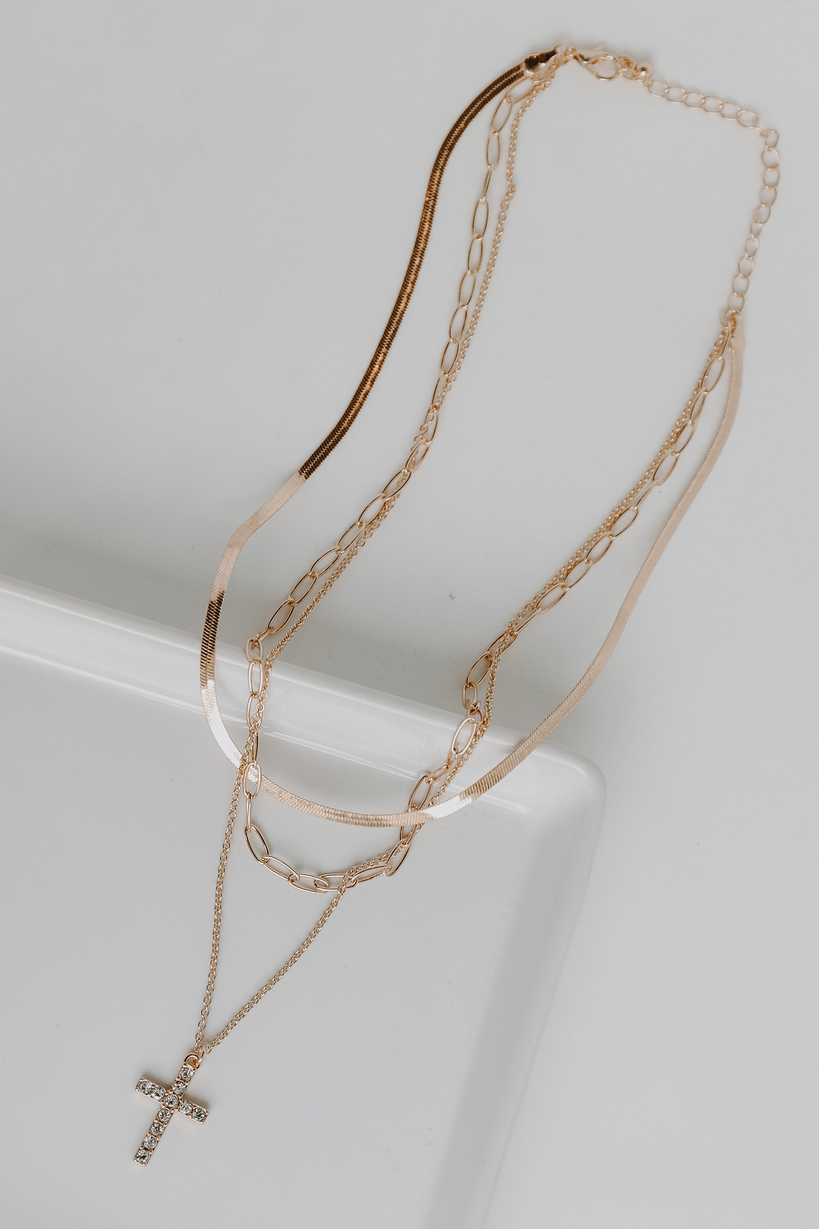 Gold Rhinestone Cross Layered Necklace flat lay